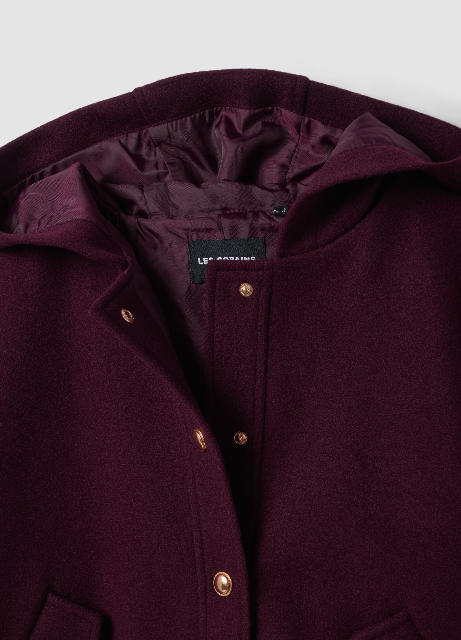 Purple hooded jacket with press-stud fastening