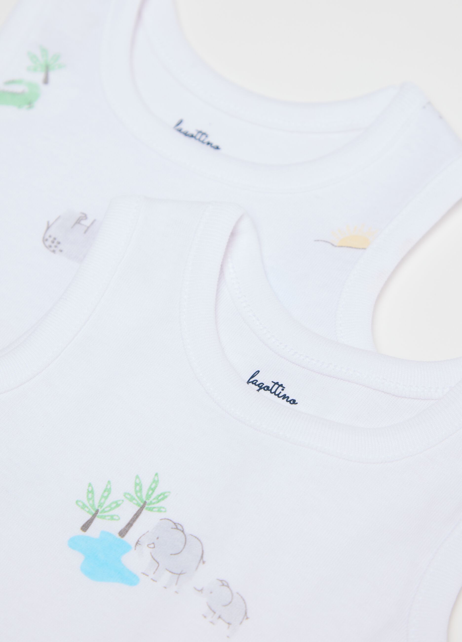 Three-pack white and light blue bodysuits in organic cotton with print