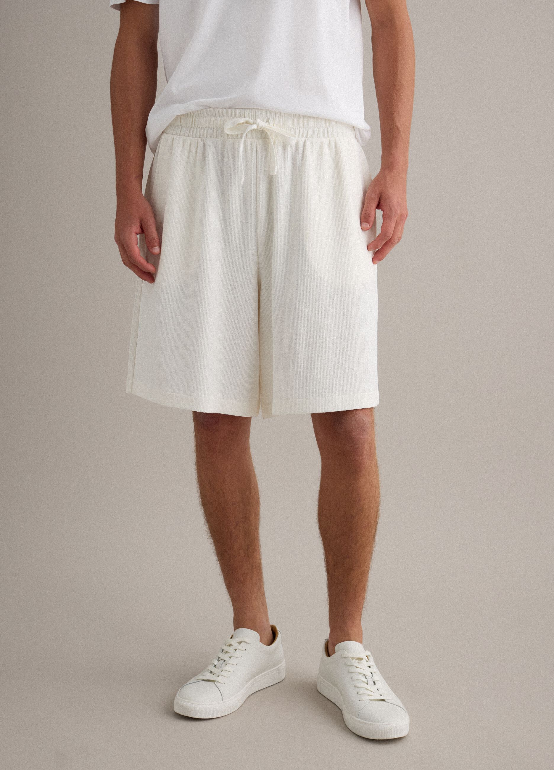 White cotton-blend jogger shorts with drawstring, relaxed fit