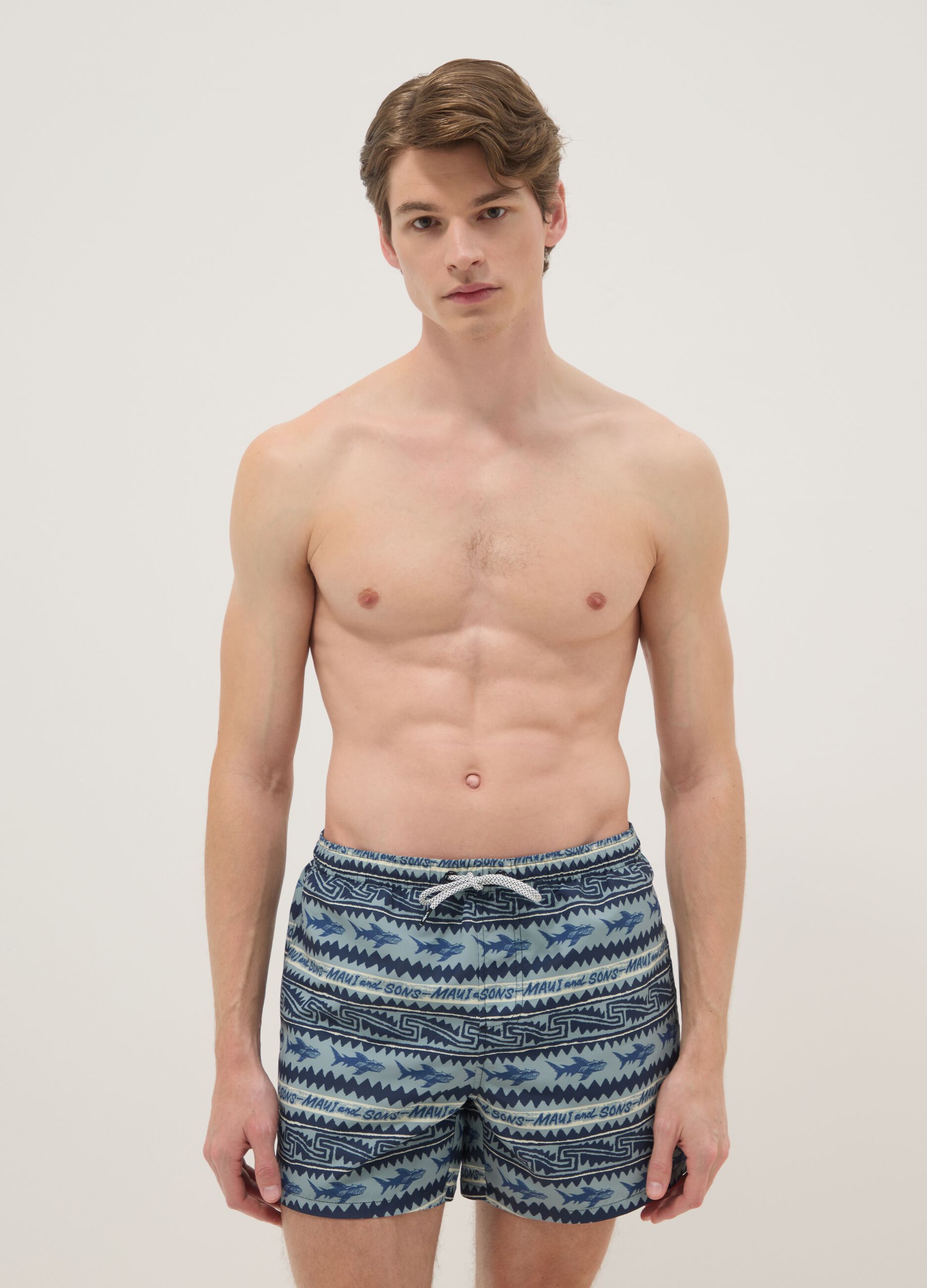 Multicolour swim shorts with sharks and geometric patterns