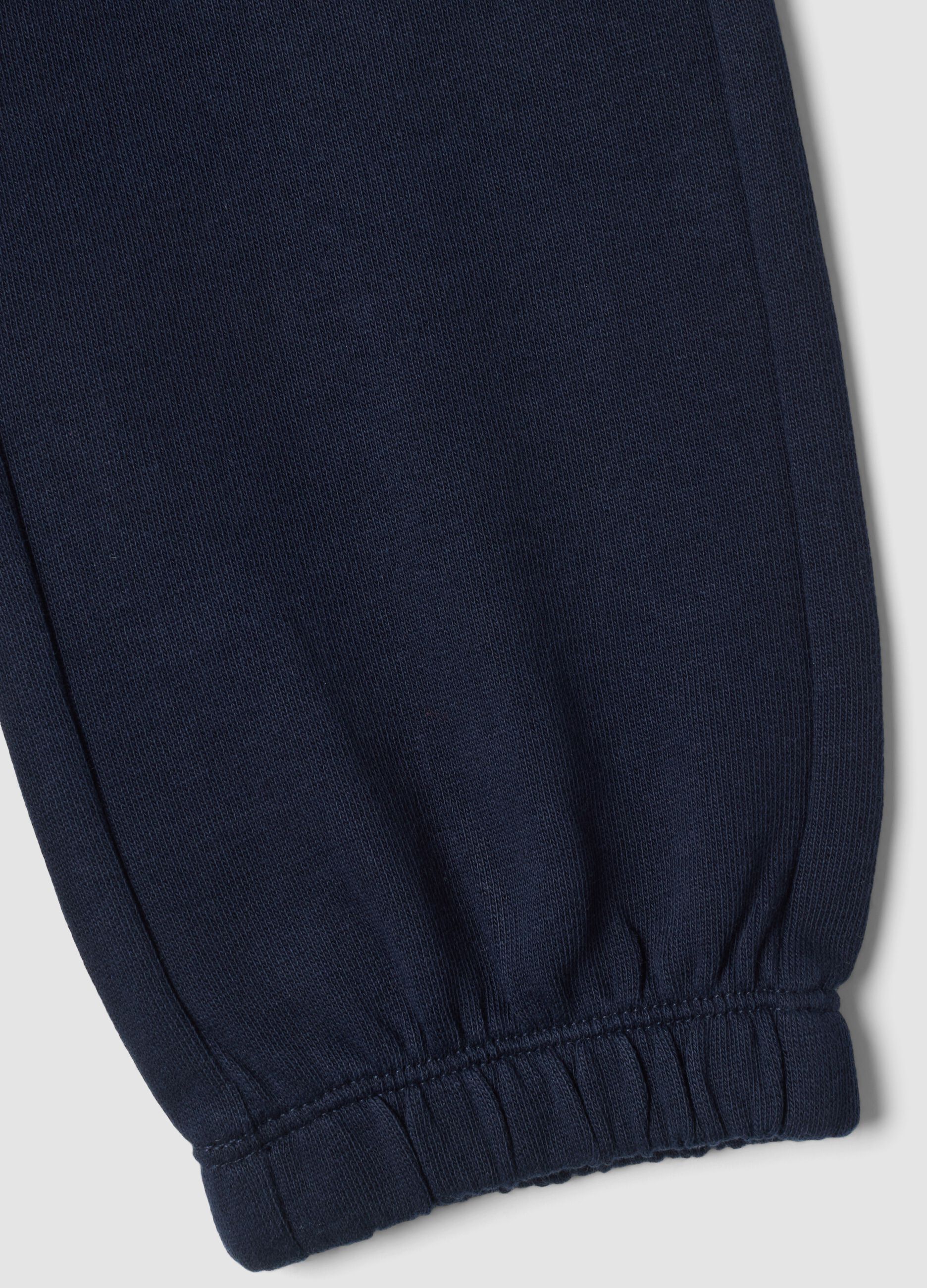 Pantaloni jogger blu in puro cotone con stampa