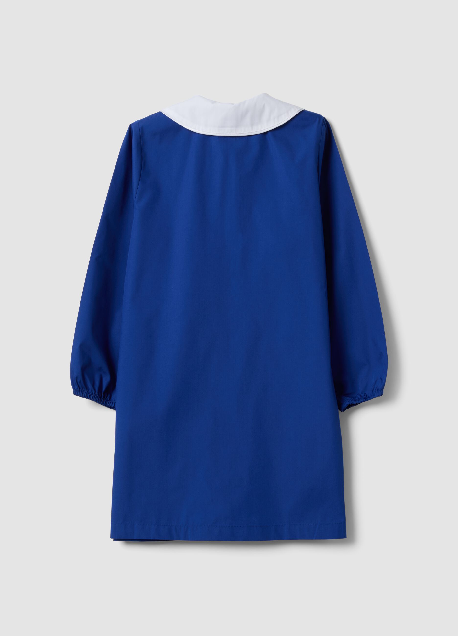 Blue girls&rsquo; school apron with rhinestone details and floral embroidery