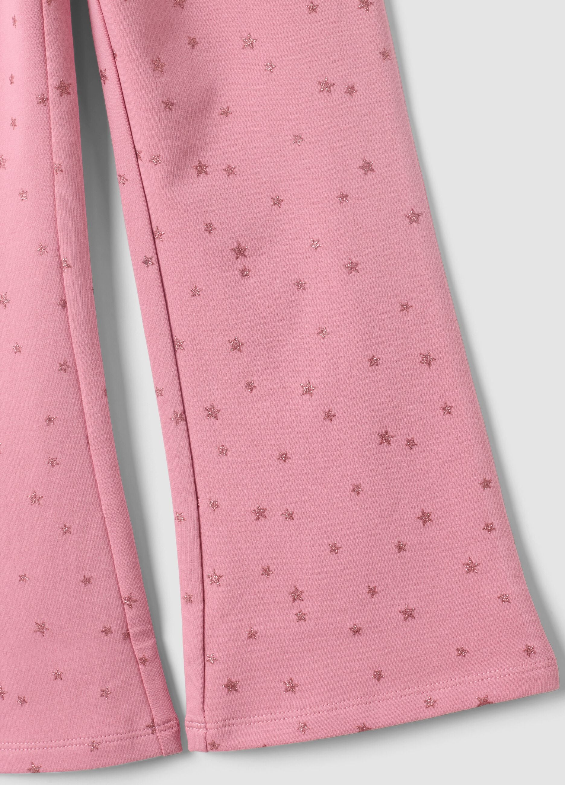 Pink flared stretch cotton trousers with star print for girls