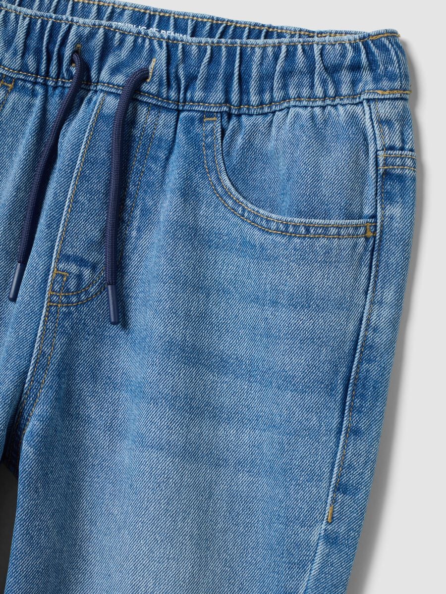 Jeans jogger denim blu in misto cotone e viscosa per ragazzo_1