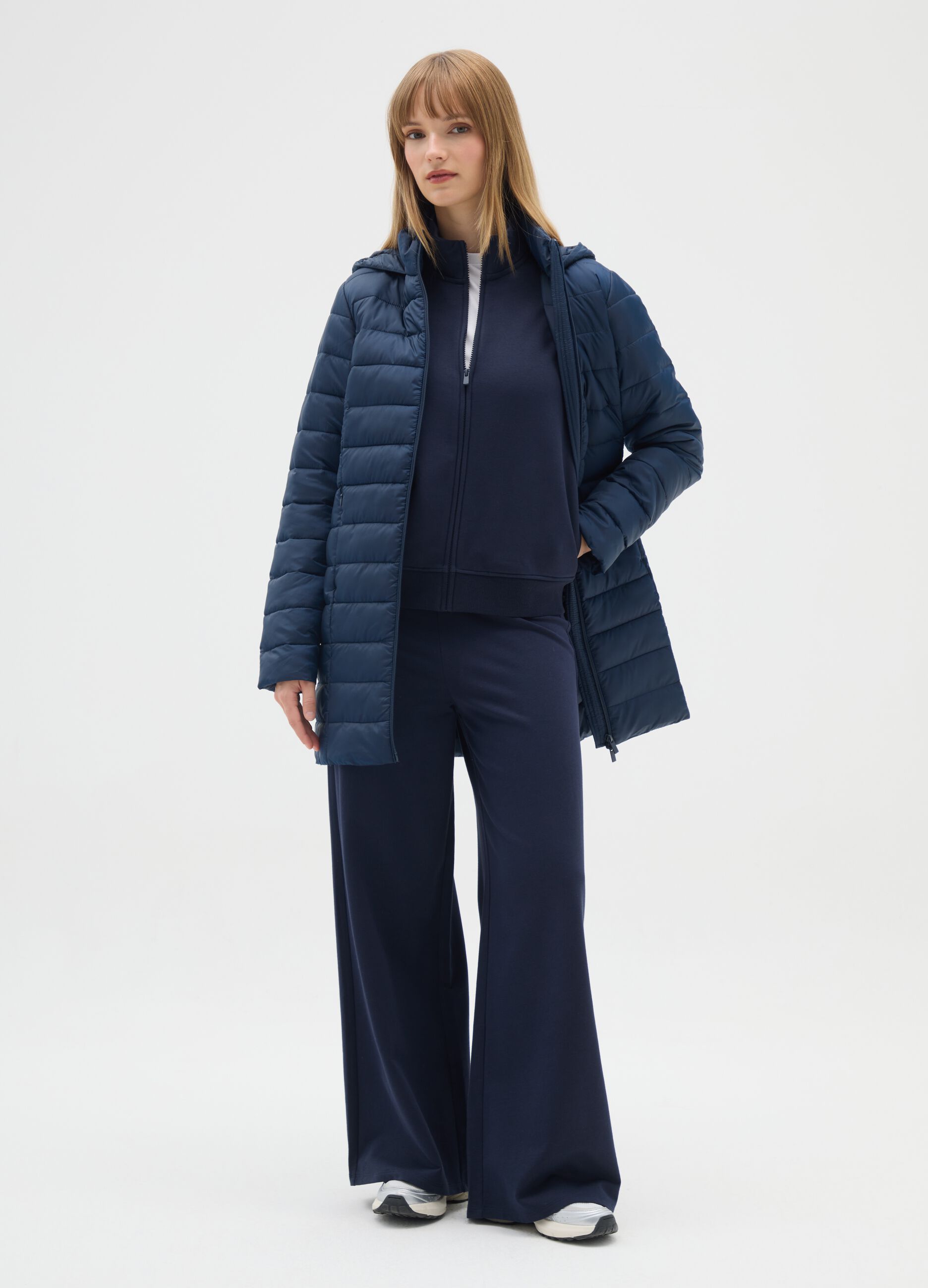 Long padded blue jacket with hood and zip