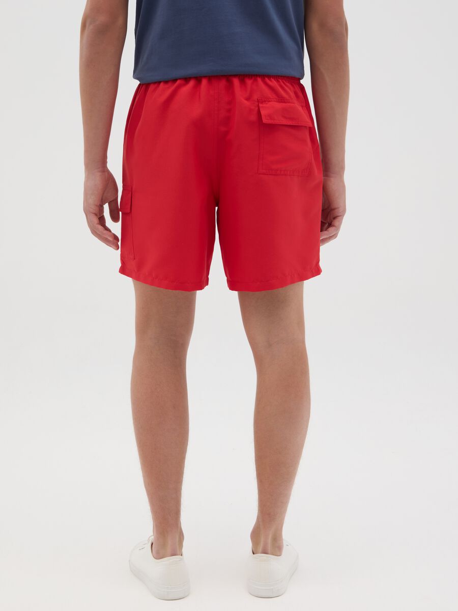 Red swimming trunks with logo print_3