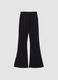 Pantaloni neri in tessuto elasticizzato a zampa slim fit con glitter_0