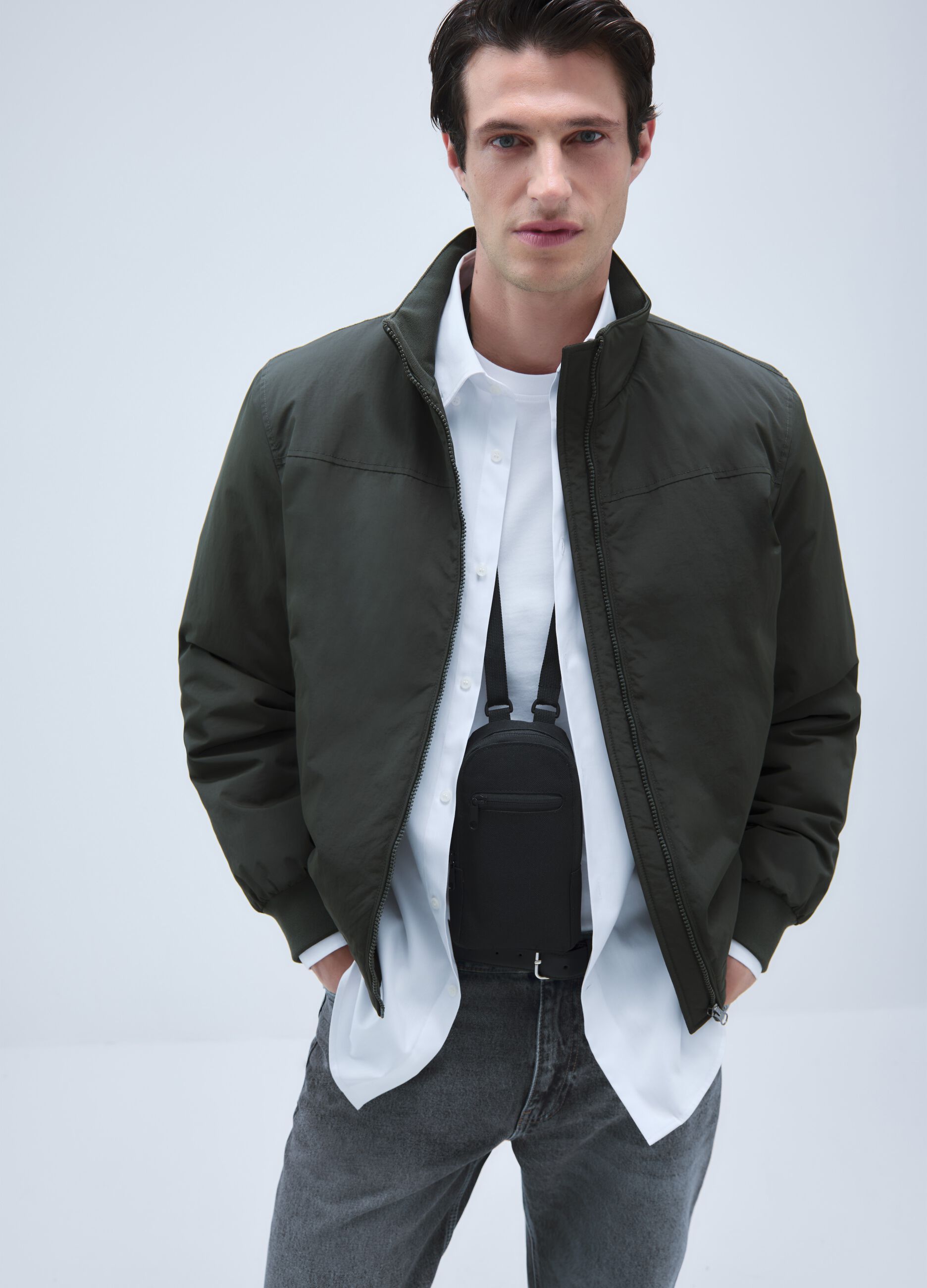 Green padded jacket with zip closure