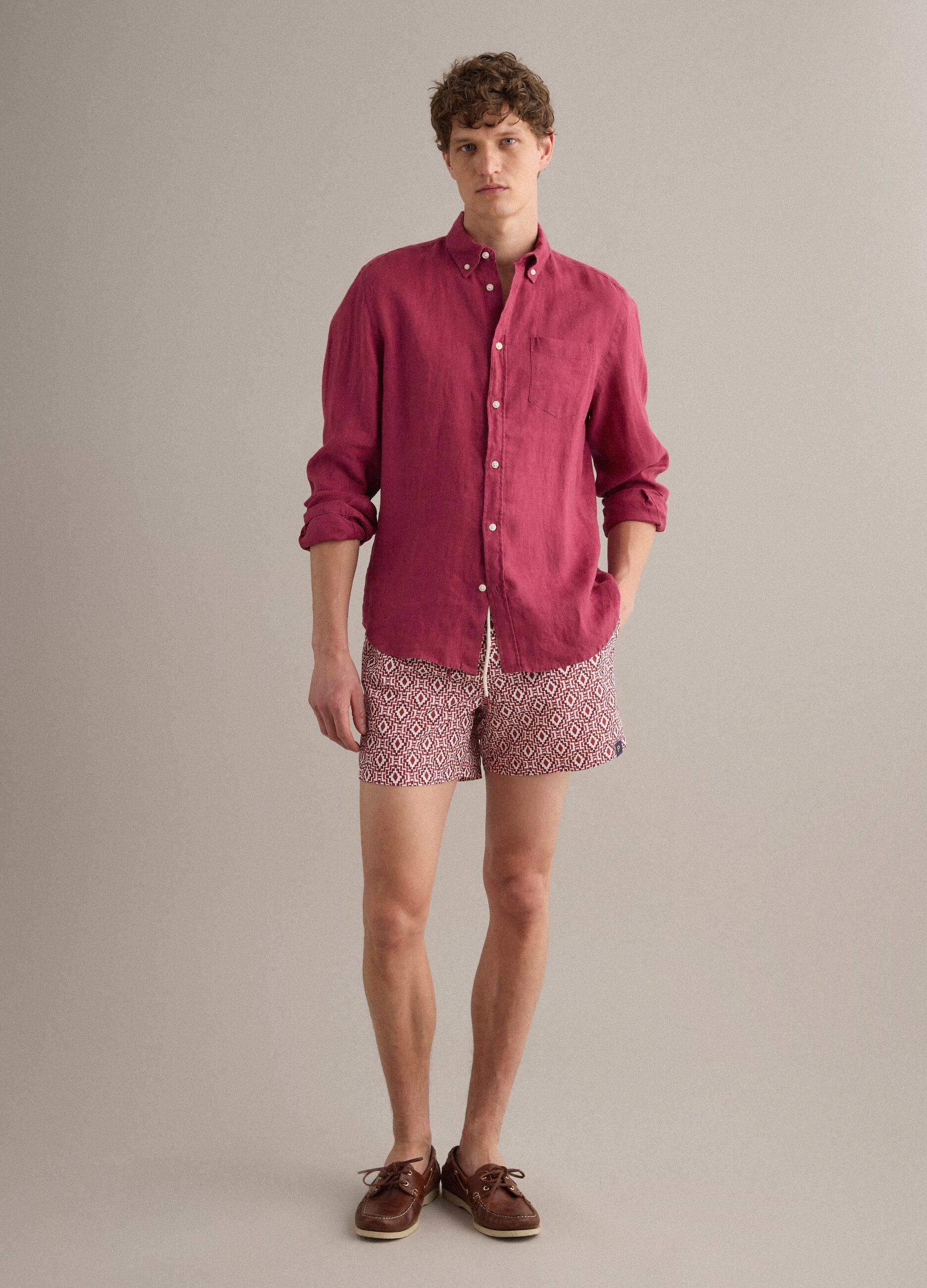 Red swim shorts with geometric print