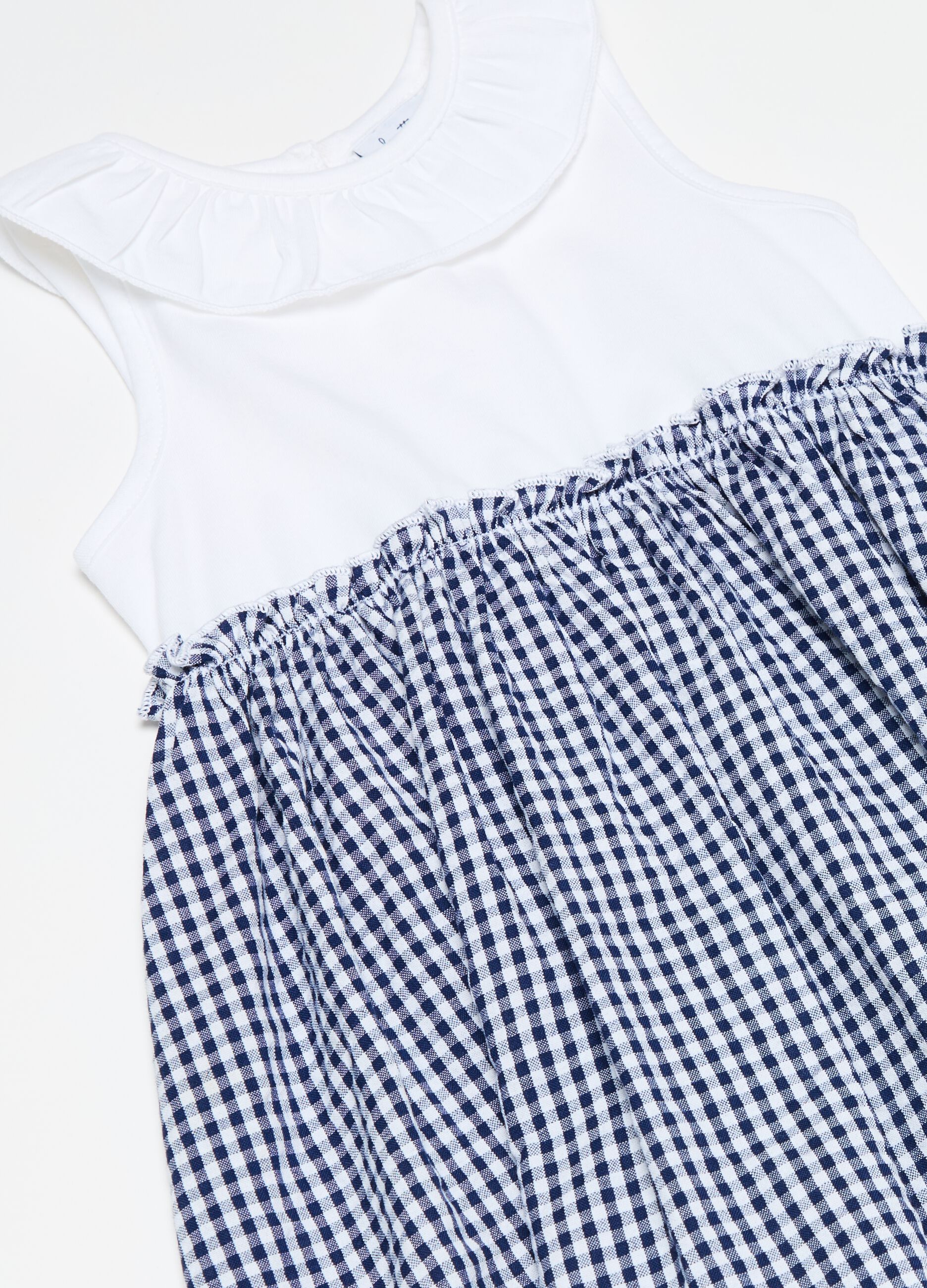 Sleeveless dress with gingham skirt