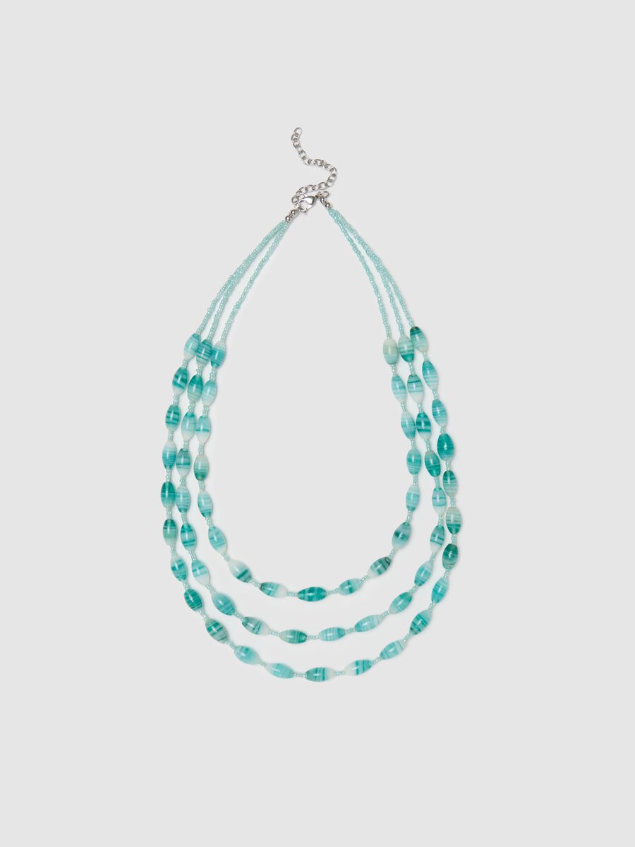 Multi-strand necklace with light blue beads_0