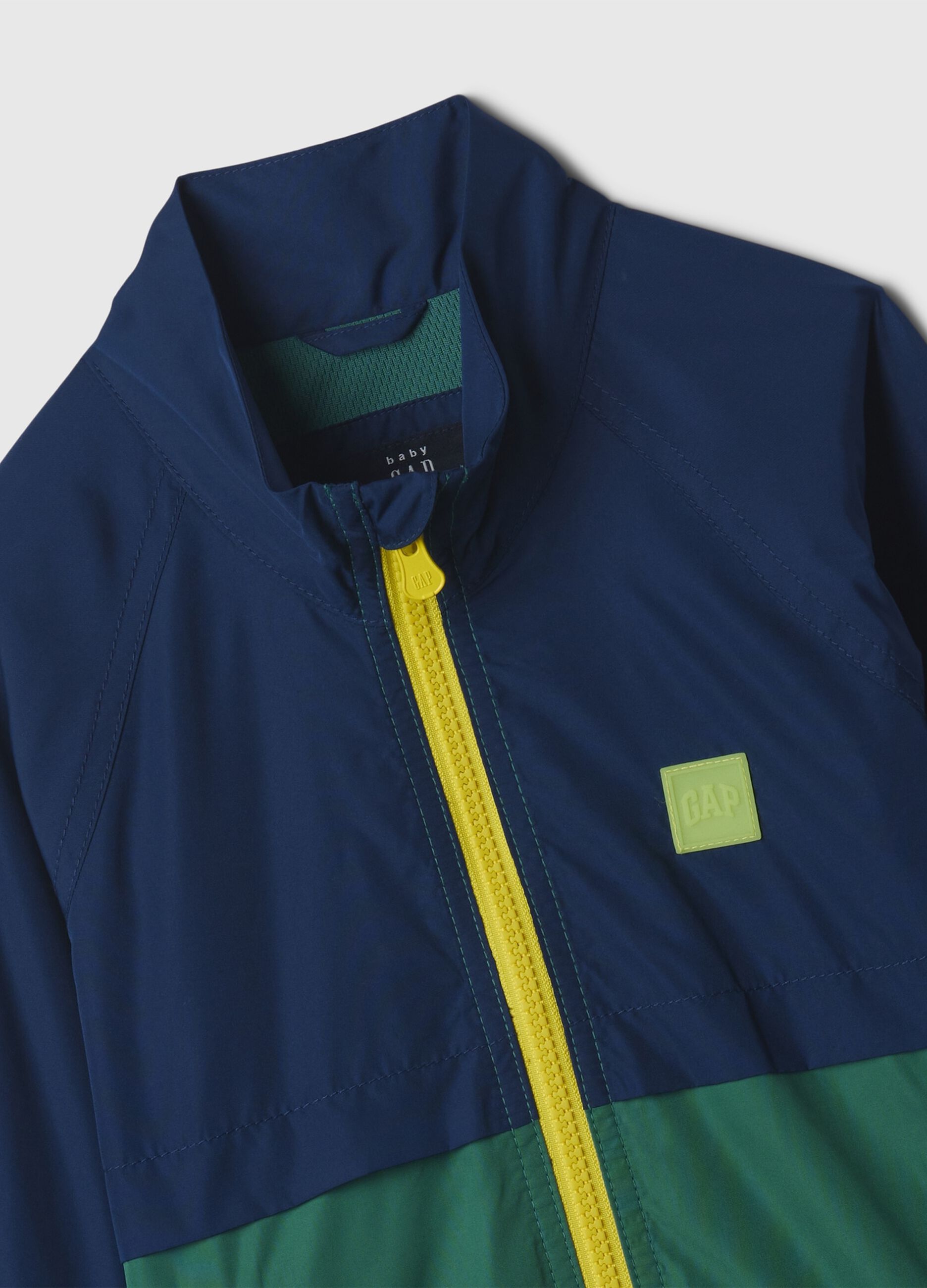 Two-tone windbreaker with logo patch