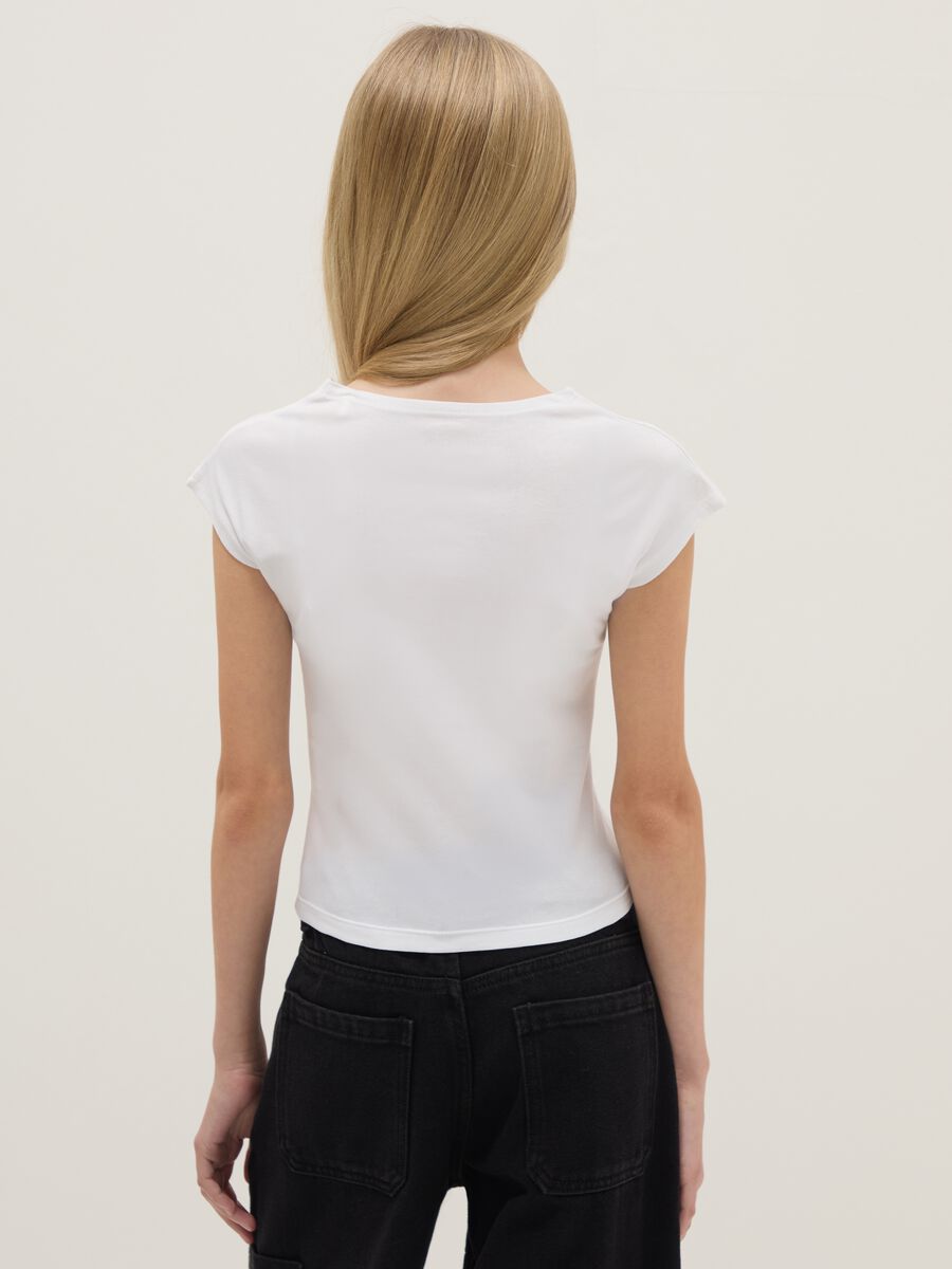 T-shirt in cotone elasticizzato bianca da ragazza slim fit con stampa_1