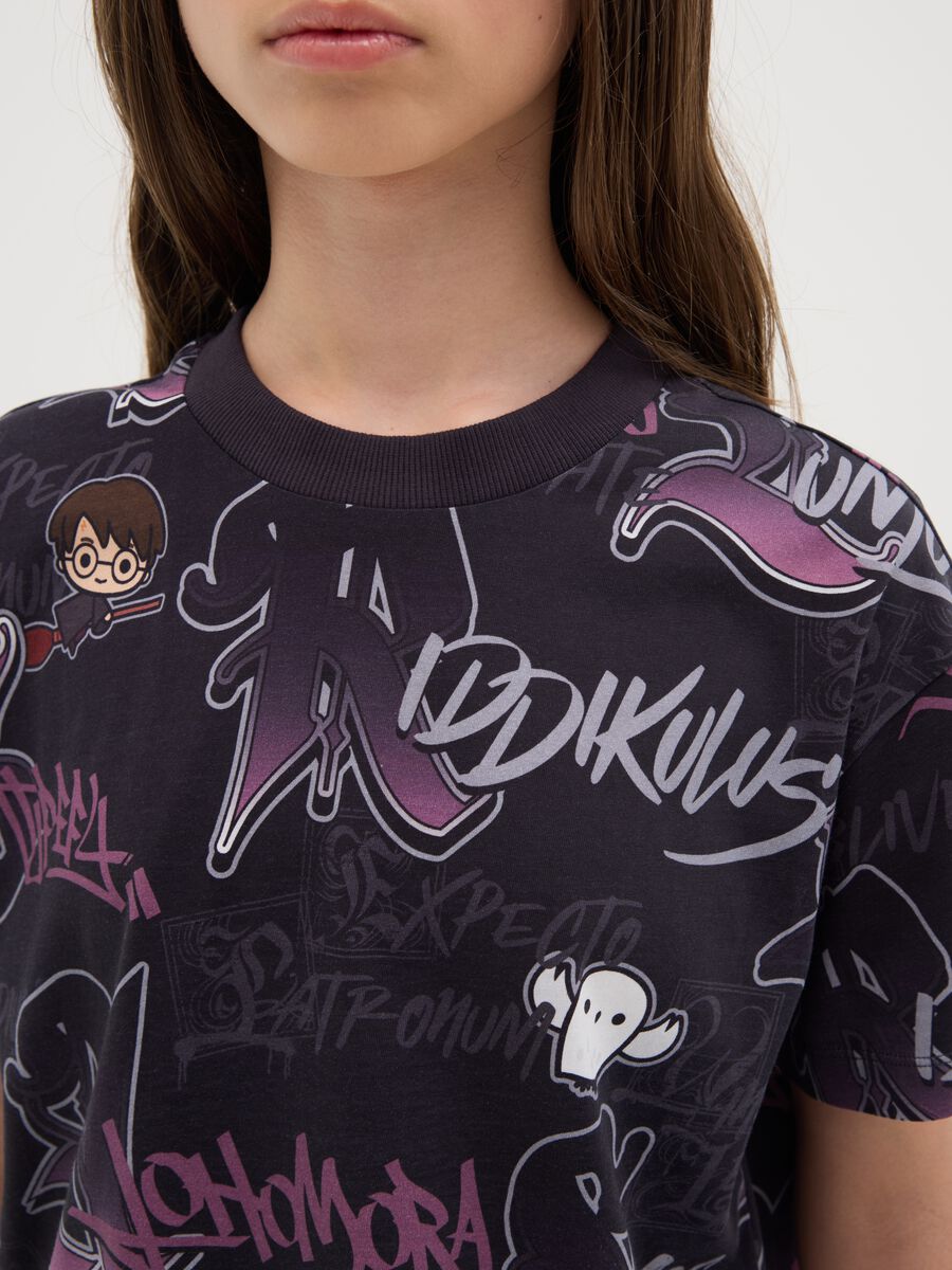 Girls’ oversized black T-shirt in 100% cotton with bold pattern_1