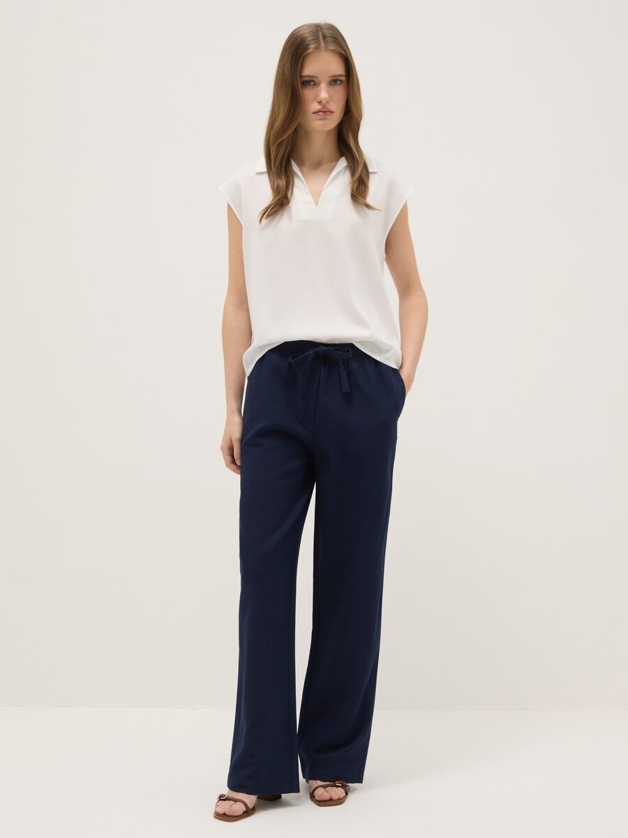 Camicetta senza maniche in pura viscosa bianca regular fit con scollo a V_1