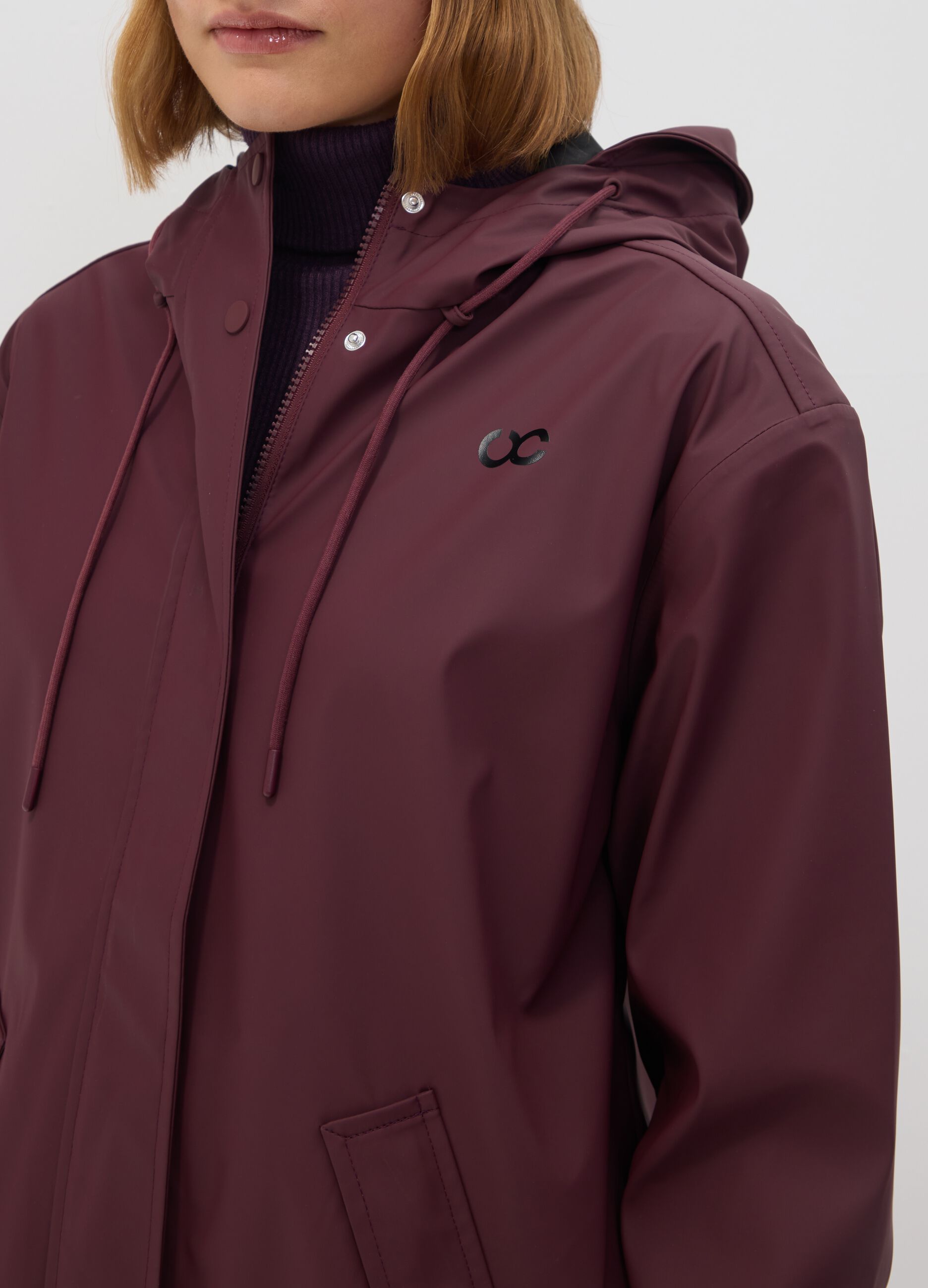 Red rain jacket with zip and hood