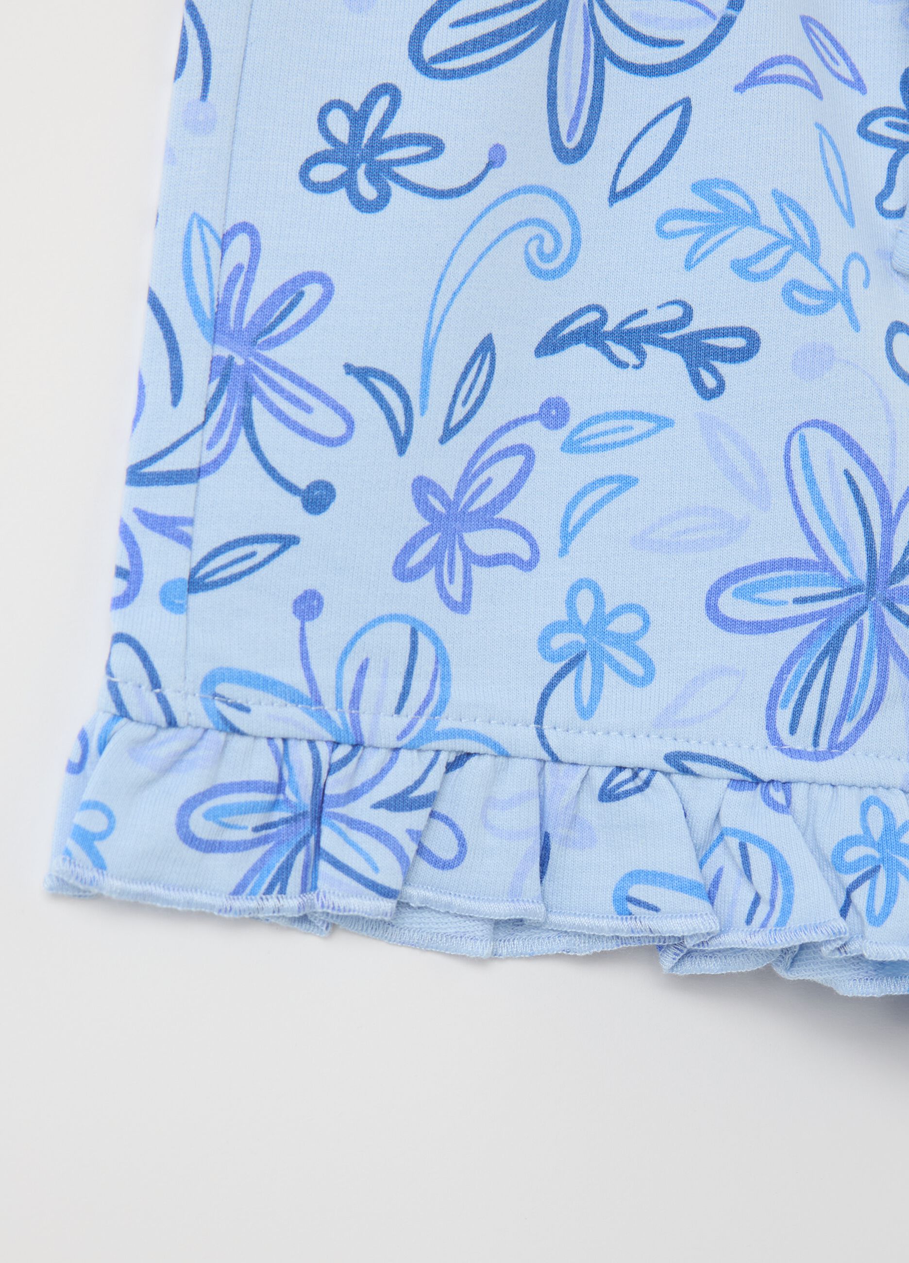 Light blue French terry shorts with drawstring and print