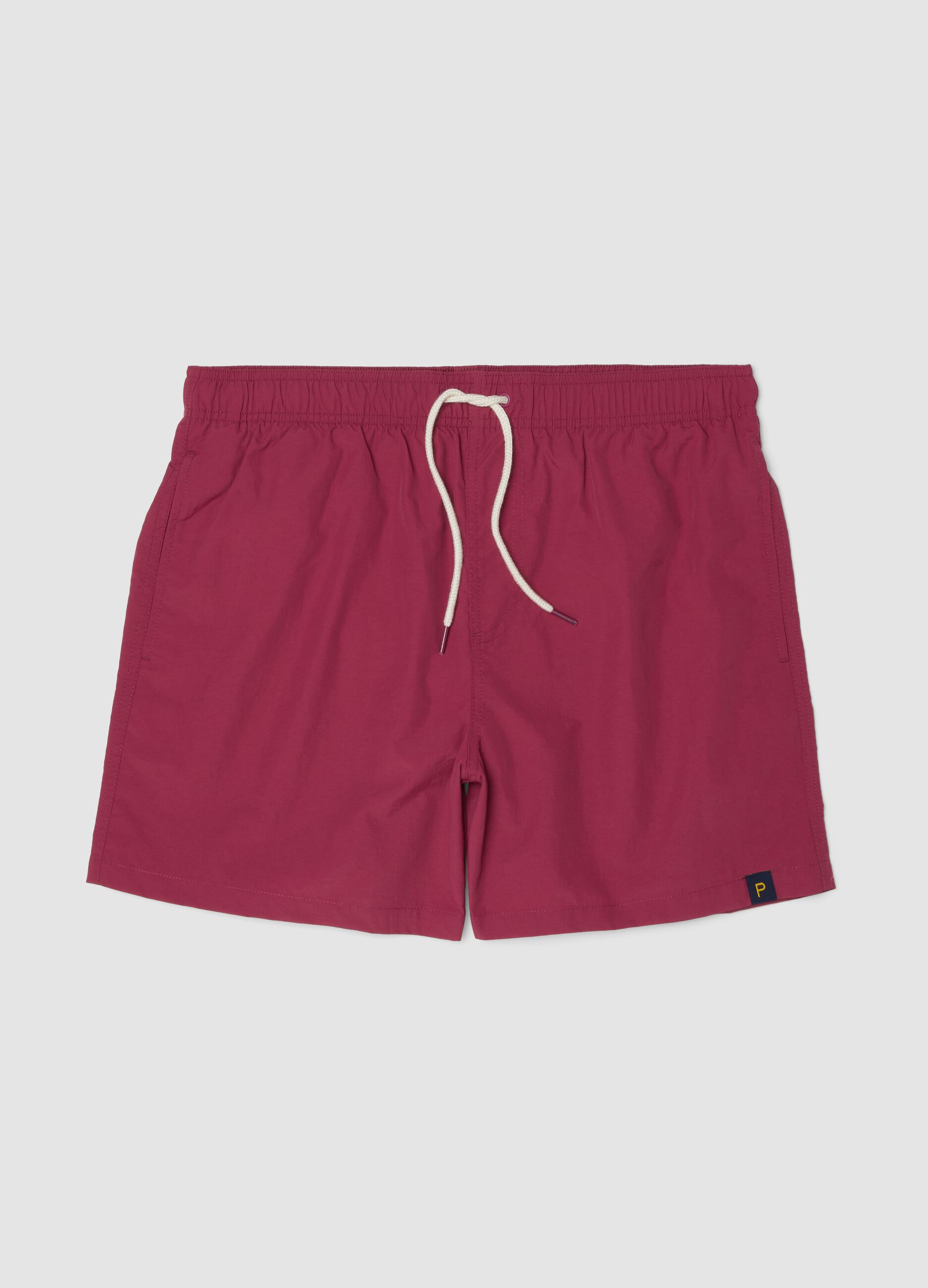 Red swim shorts with elasticated waistband and drawstring