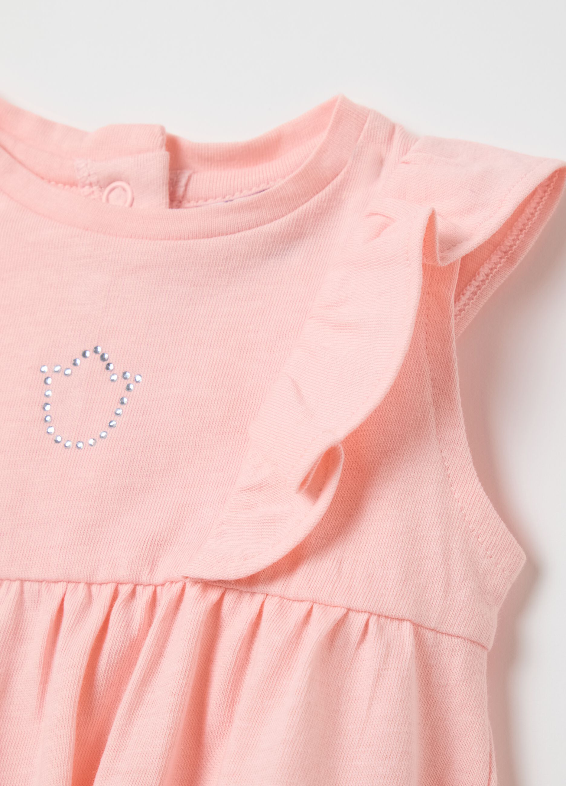 Pink cotton romper with ruffles