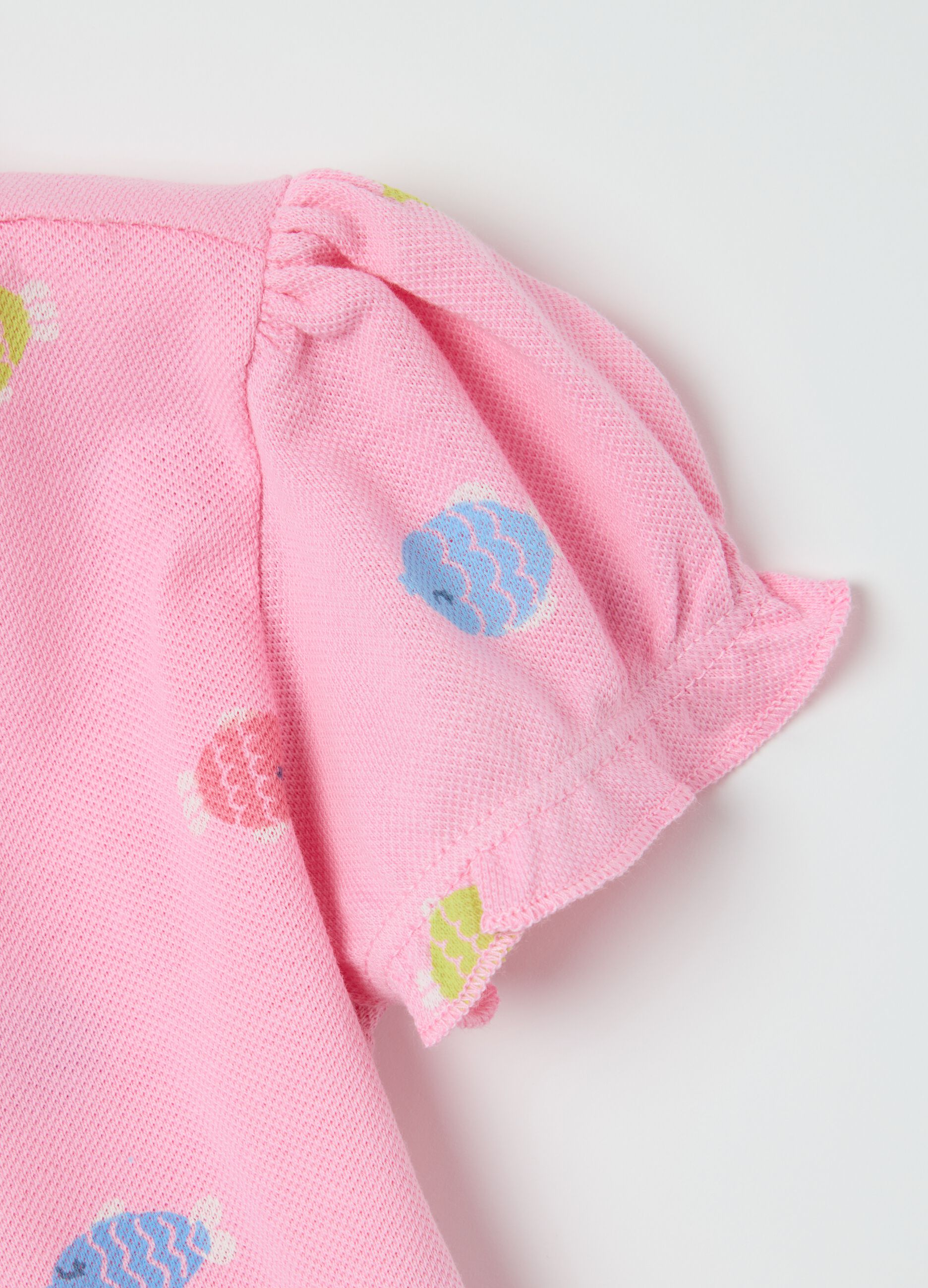 Pink polo with fish pattern in organic cotton