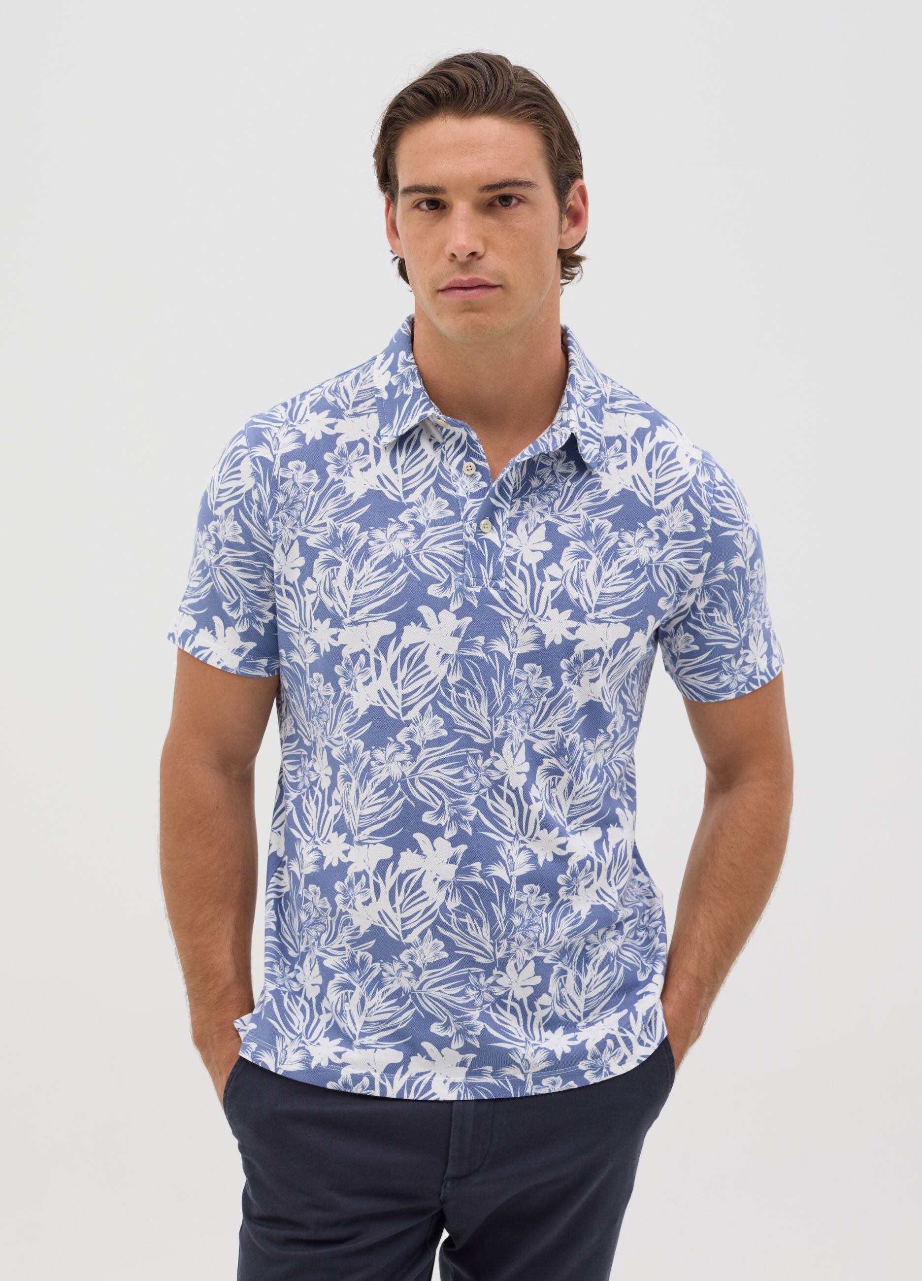 BST blue polo shirt with short sleeves and floral print