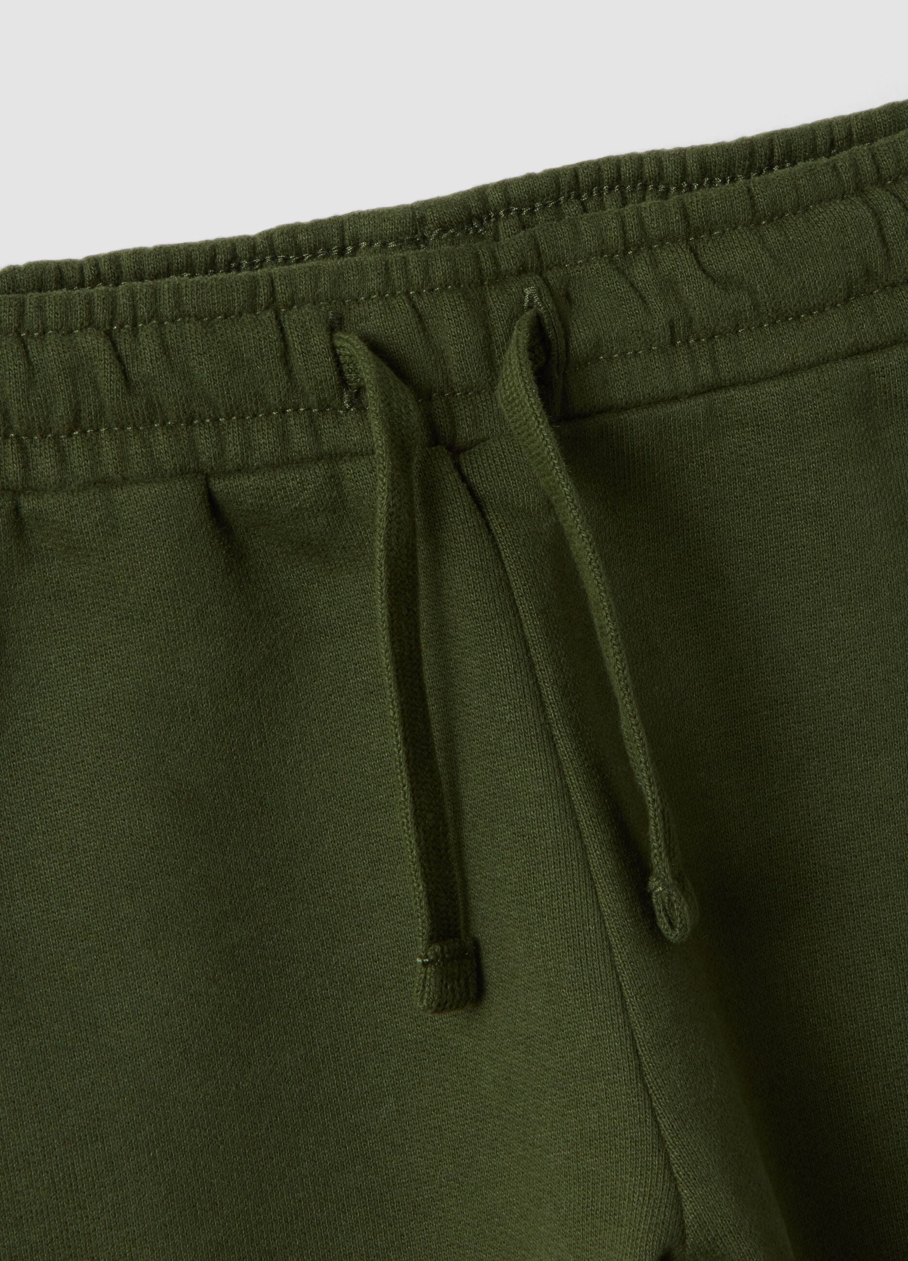 Green pure cotton over-fit joggers with teddy bear print