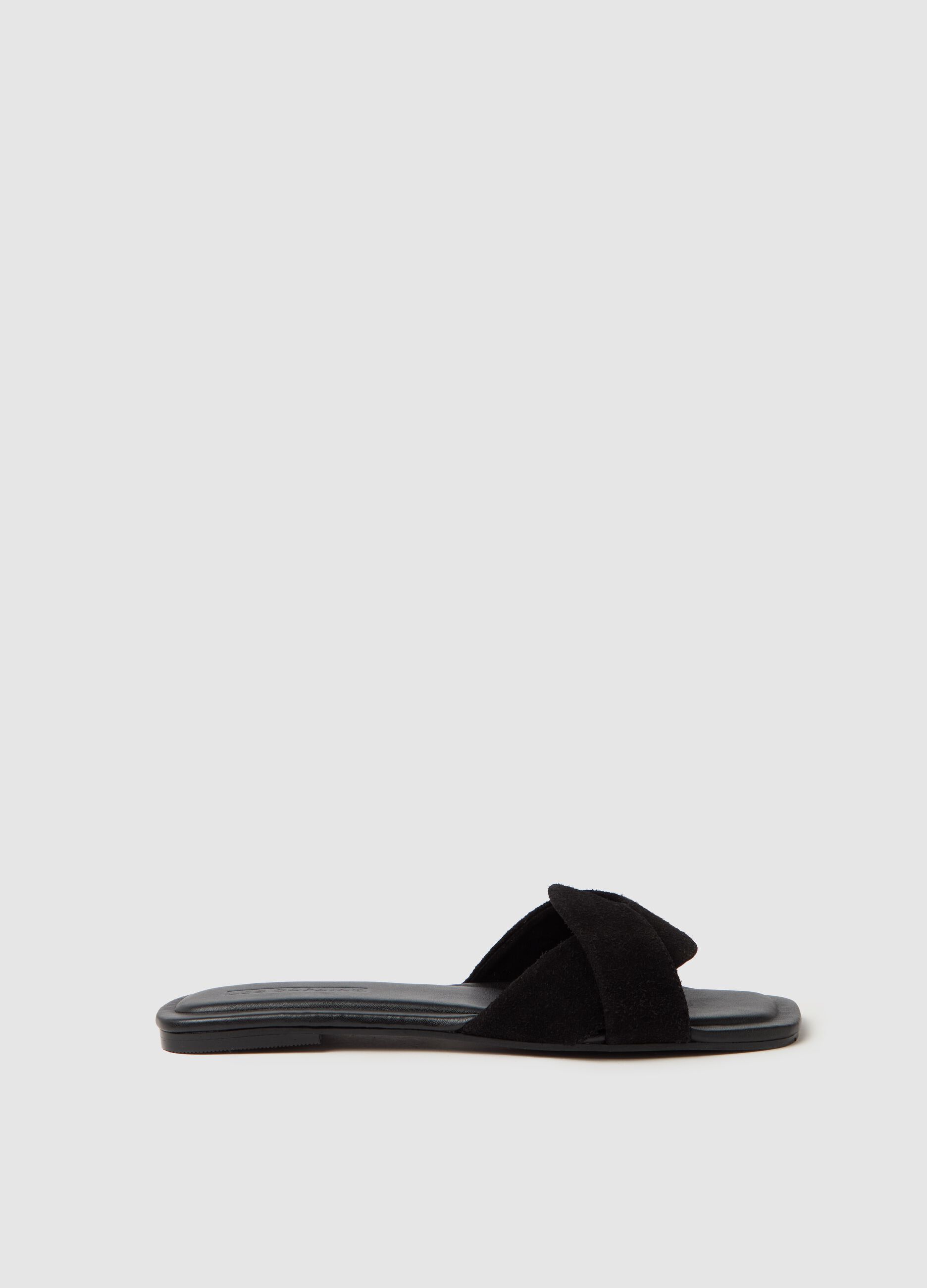 Flat open sandals in suede
