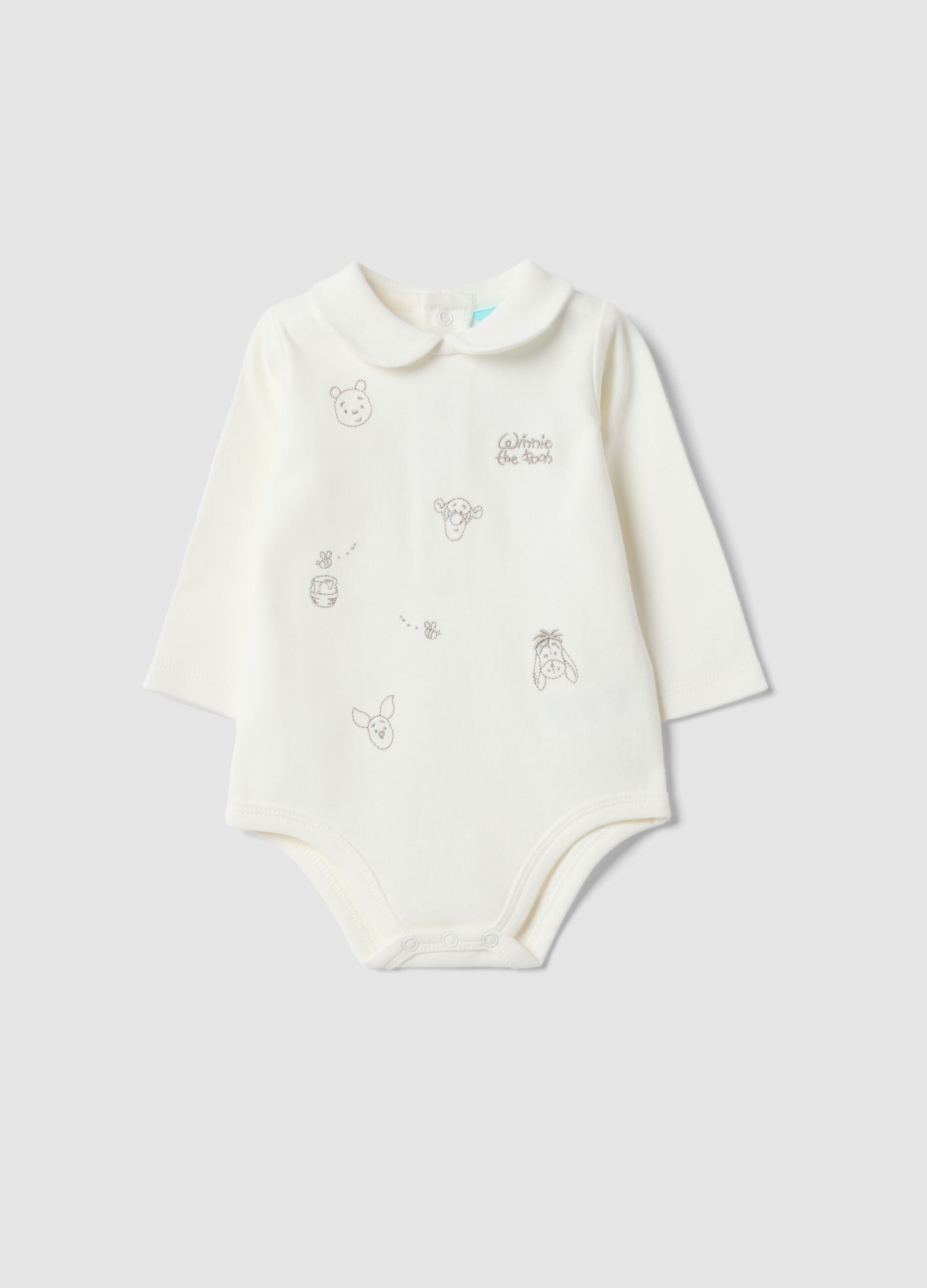 White organic cotton baby bodysuit with collar and Winnie the Pooh print