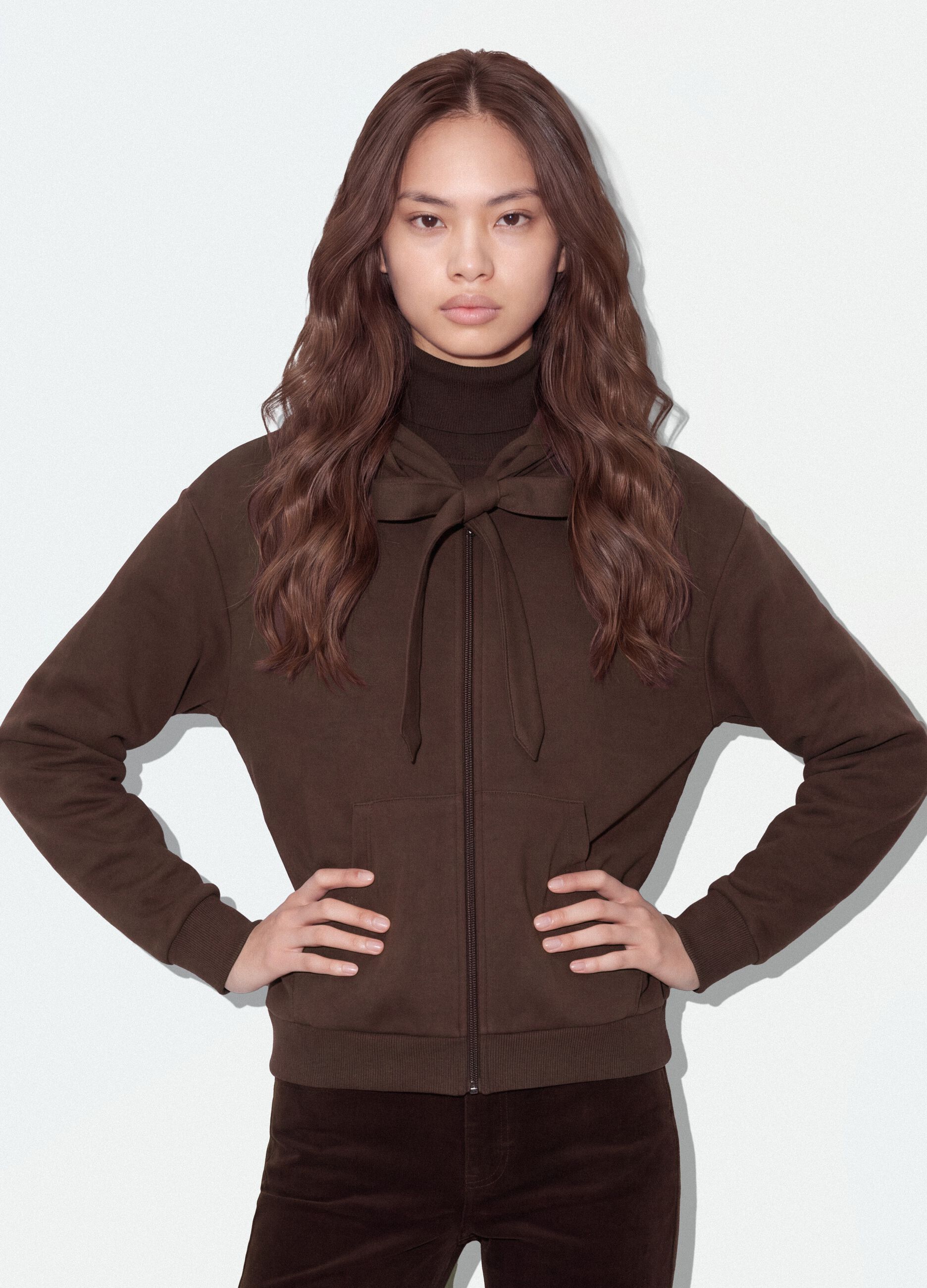 Brown hoodie with tied drawstring, relaxed fit