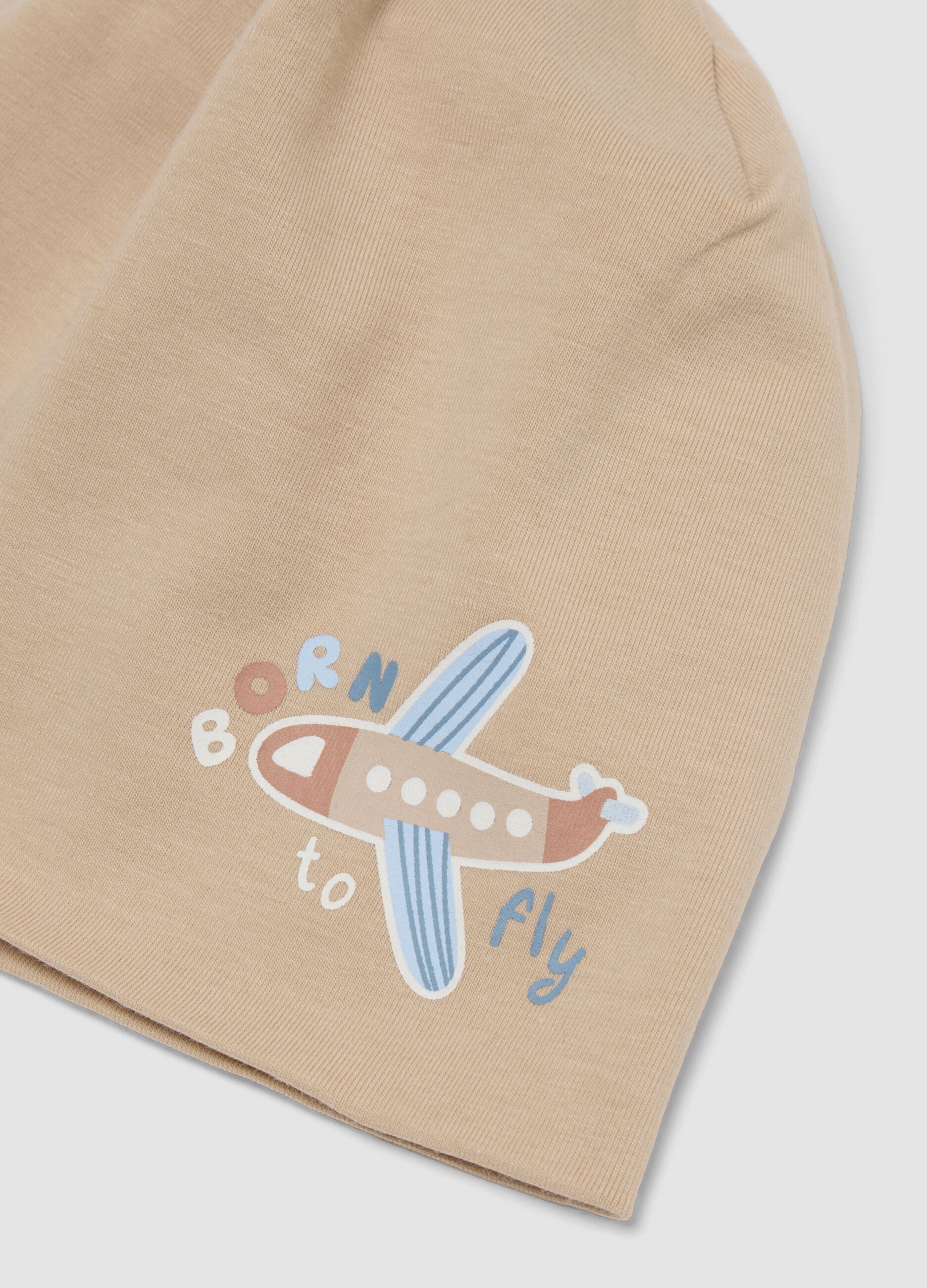 Cappello beige in cotone organico elasticizzato con stampa aeroplano
