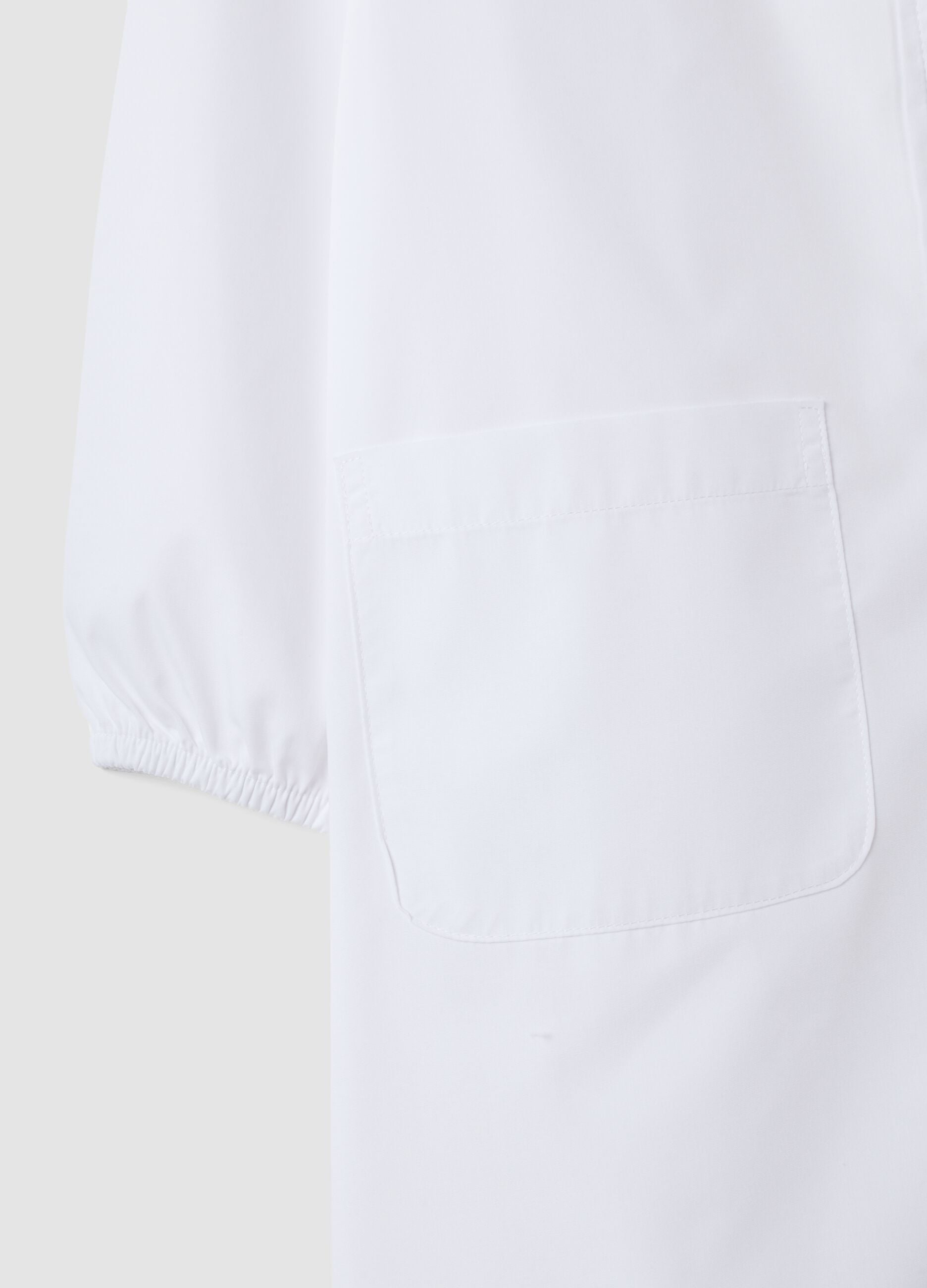 Girls&rsquo; white school apron with zip fastening and classic collar