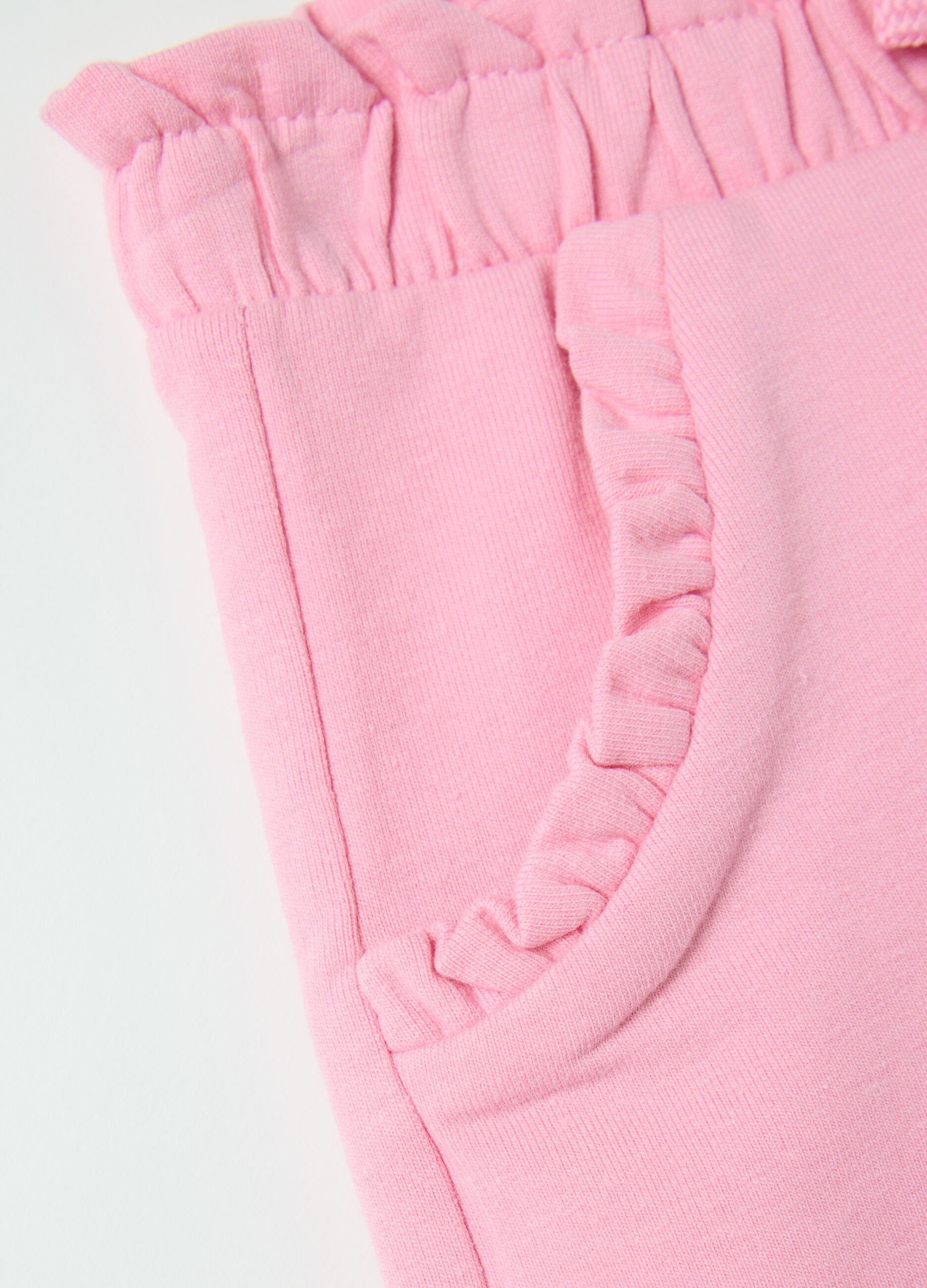 Pink French terry shorts with bow and frills