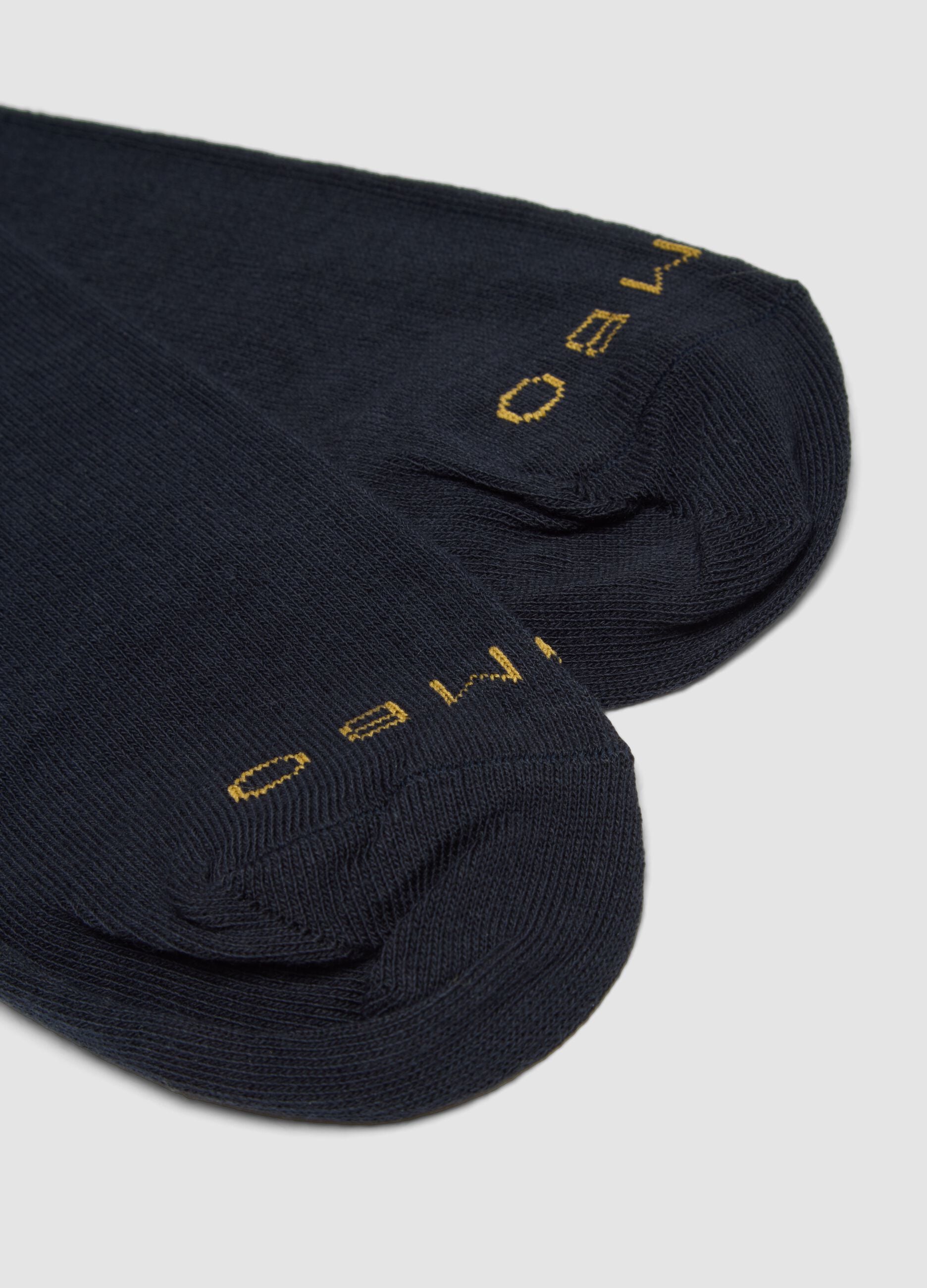 Two-pack of navy blue and golden yellow long socks in stretch cotton