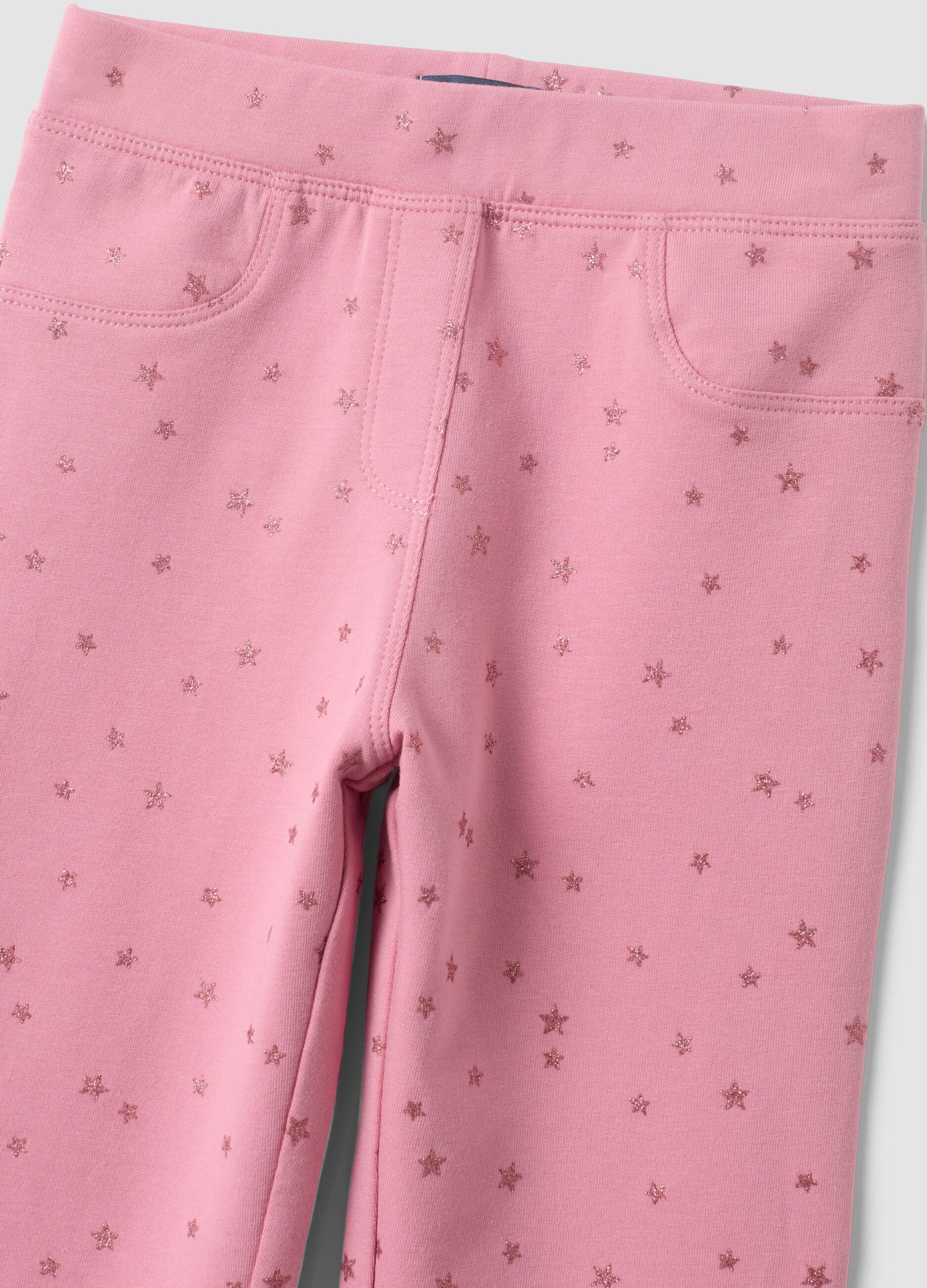 Pink flared stretch cotton trousers with star print for girls