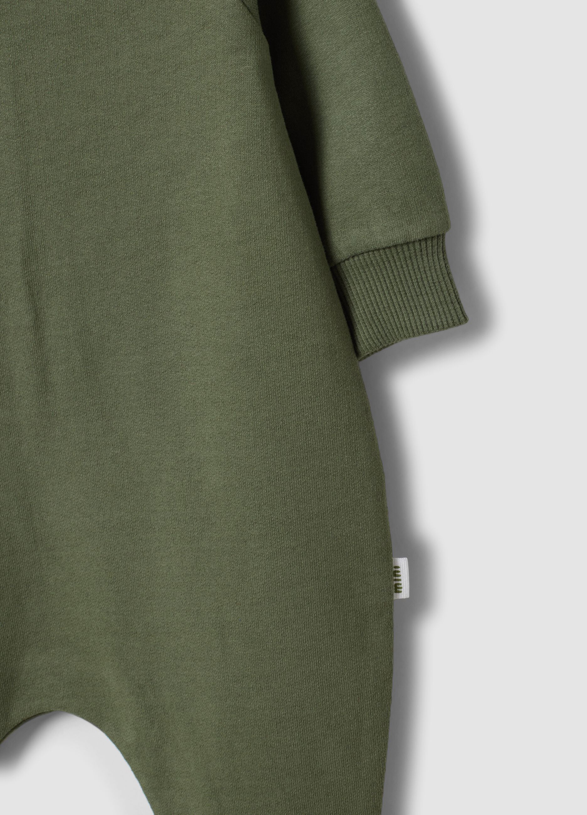 Green long-sleeved organic cotton baby sleepsuit