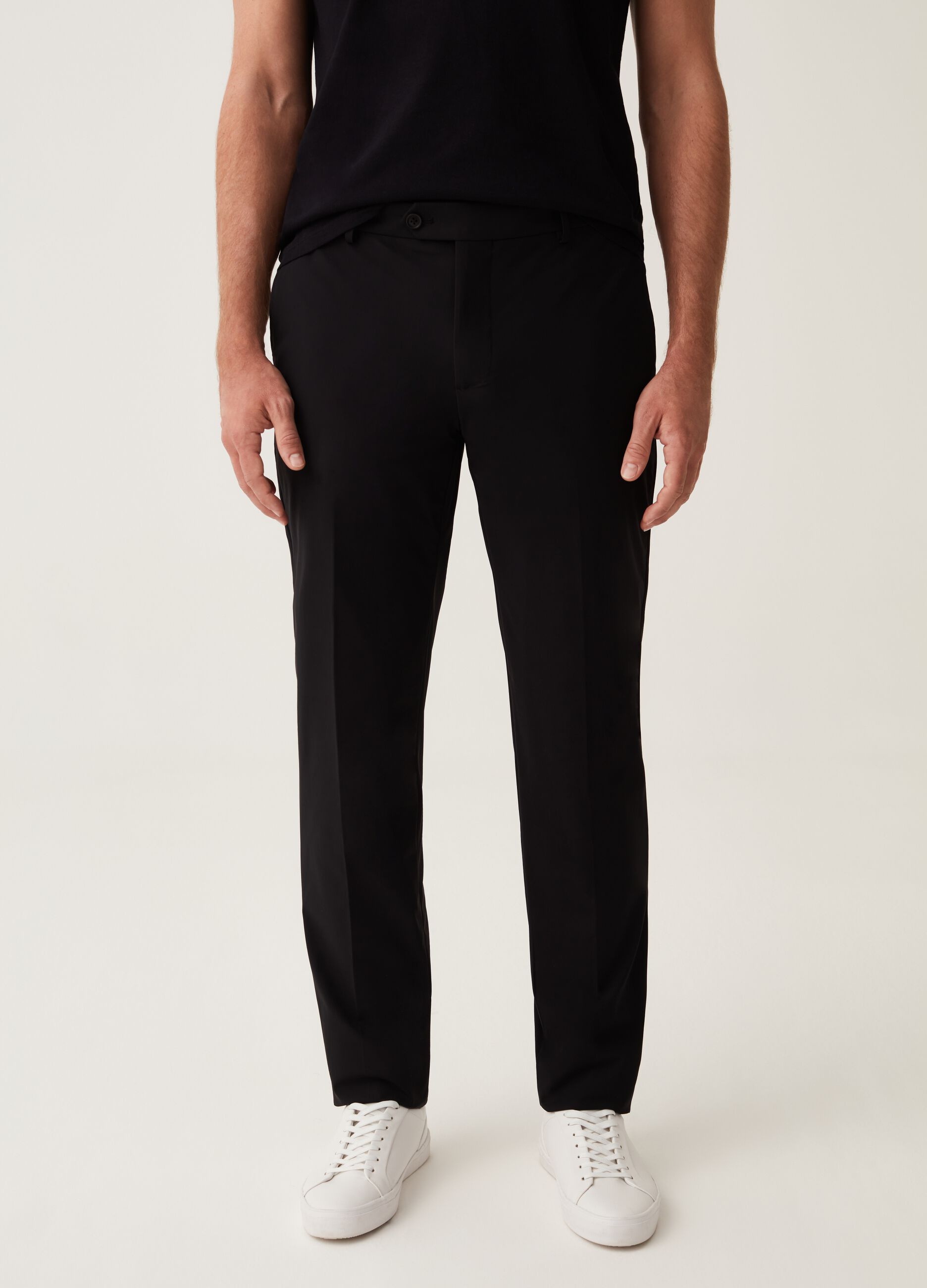 Slim-fit trousers in black technical fabric