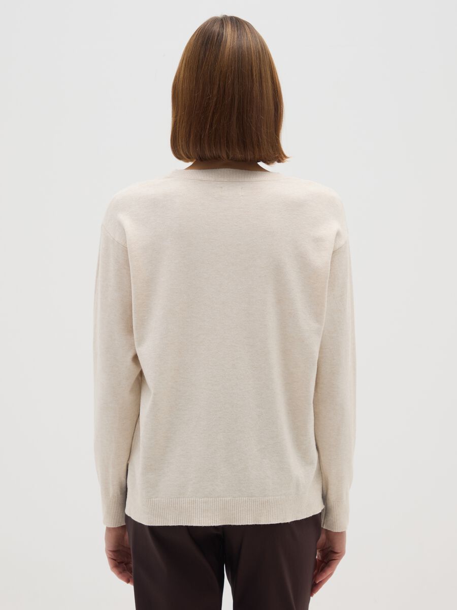 Beige long-sleeve top with textured details_2
