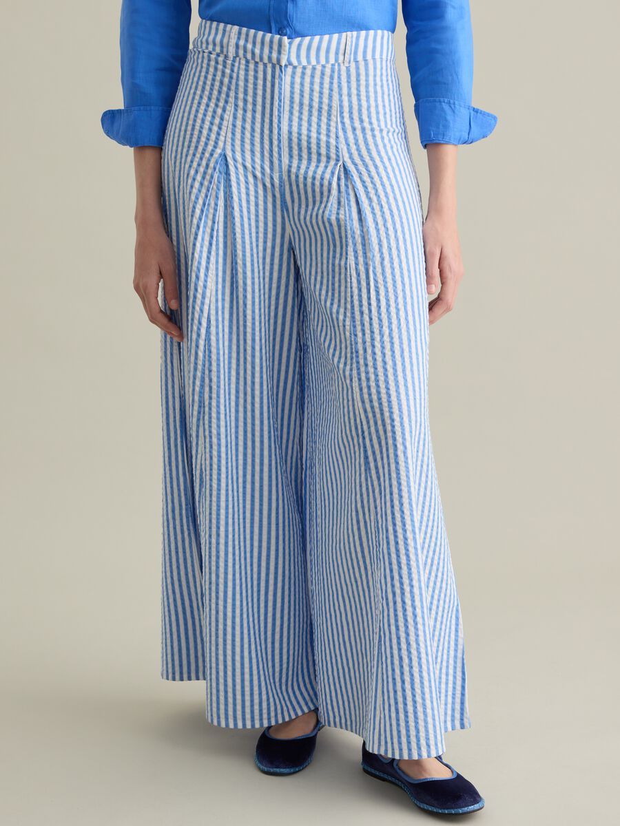 Blue flare-fit trousers in striped seersucker_1
