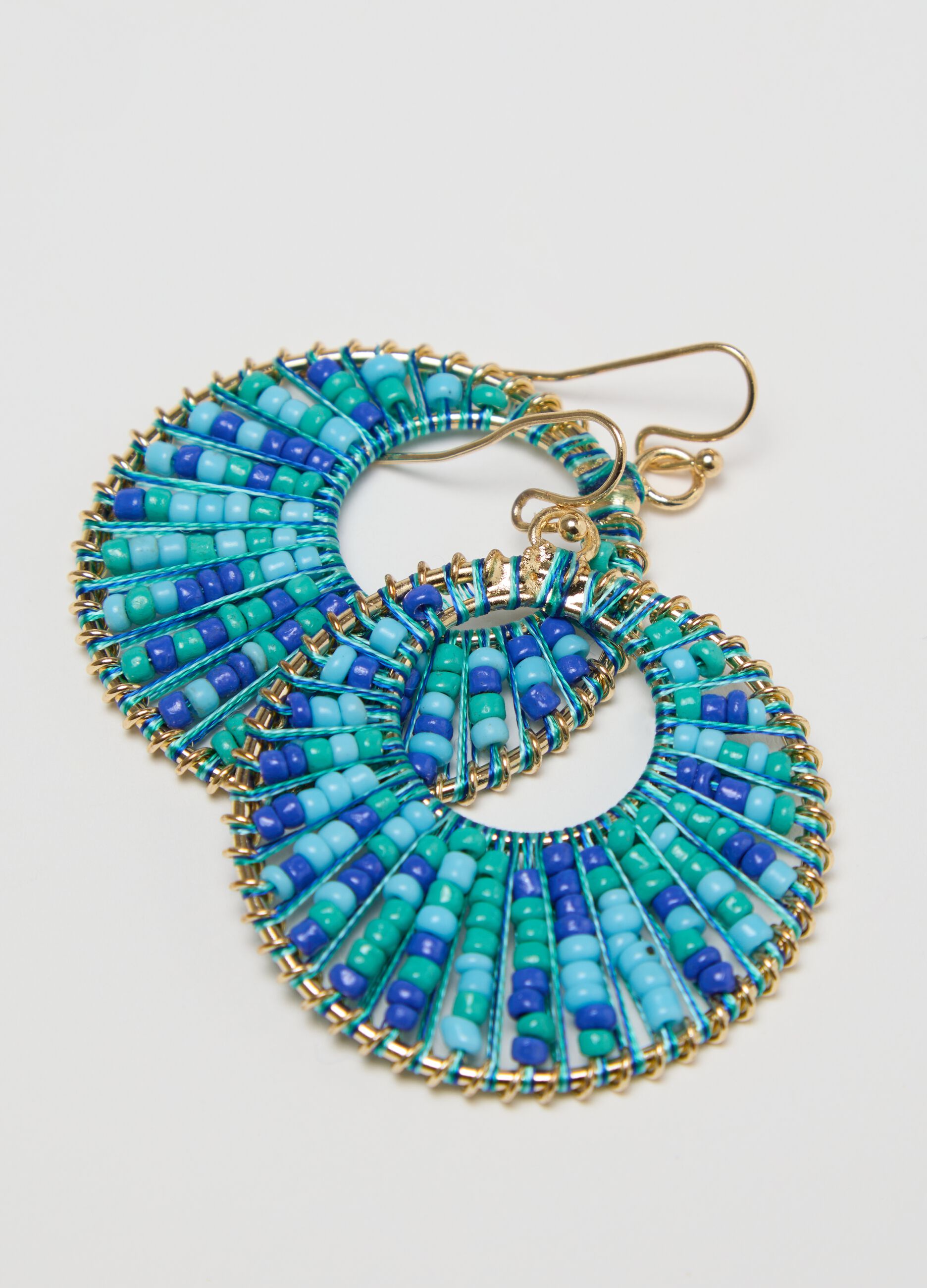 Hoop earrings with light blue and green beads