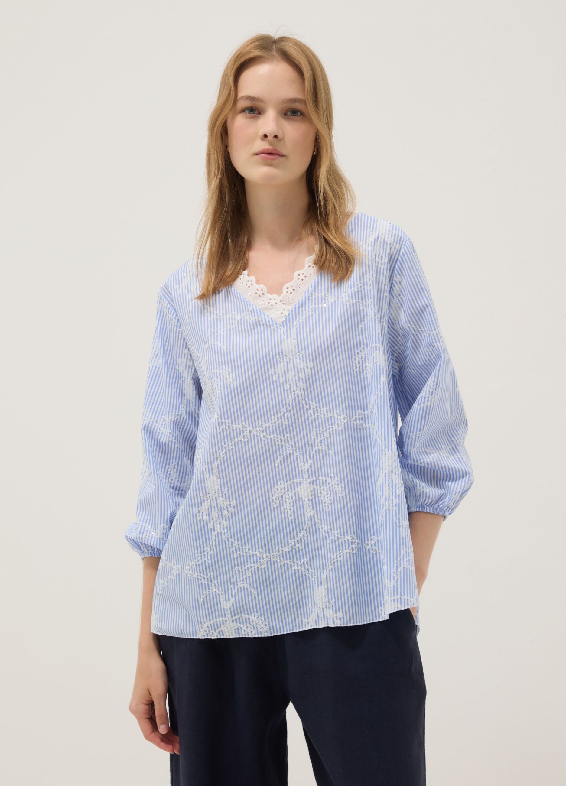 Blue cotton-blend top with embroidery and V-neck