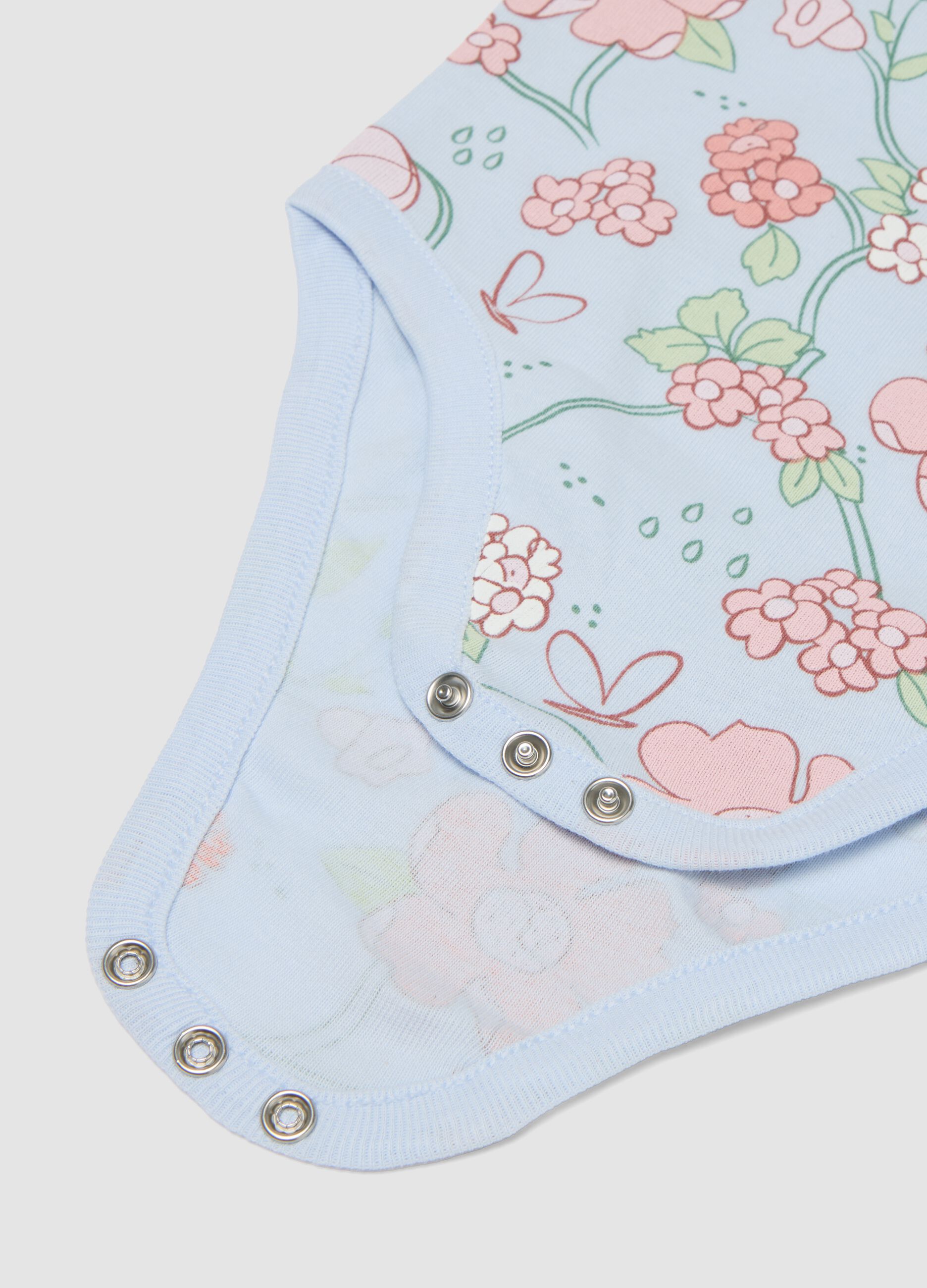 Twin pack of light blue organic cotton bodysuits with floral print