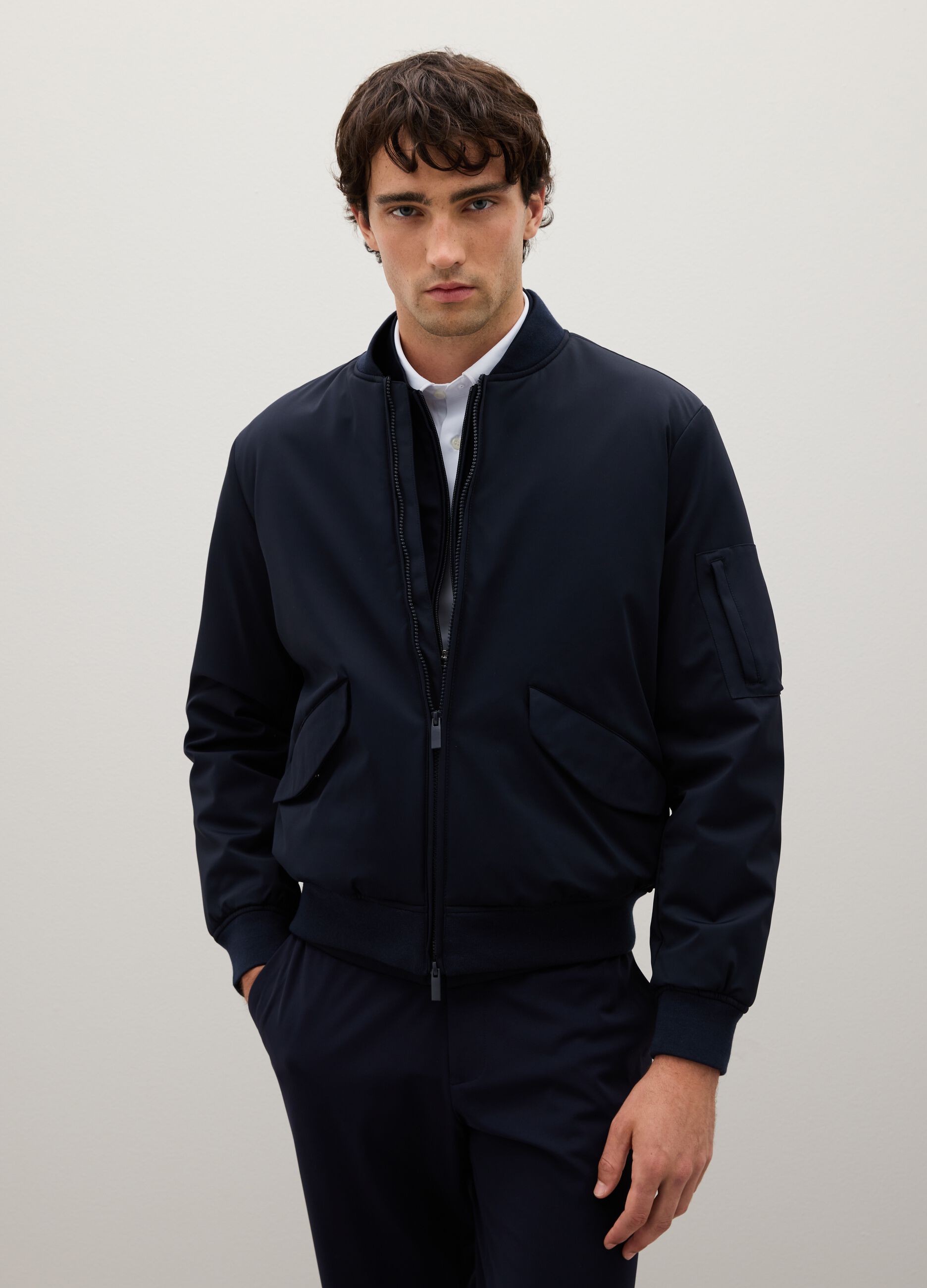 Stretch blue bomber with zip closure