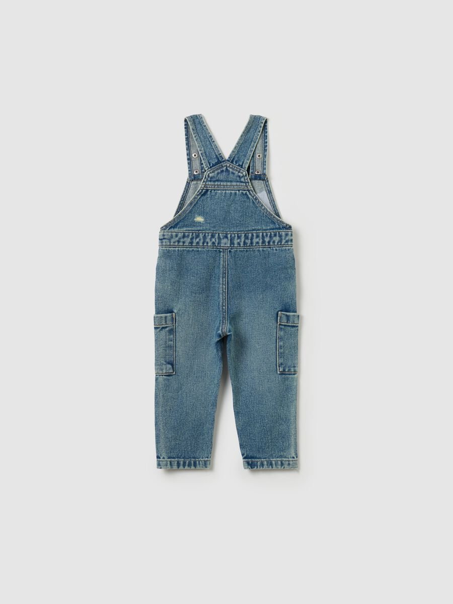 Salopette in denim con abrasioni_1