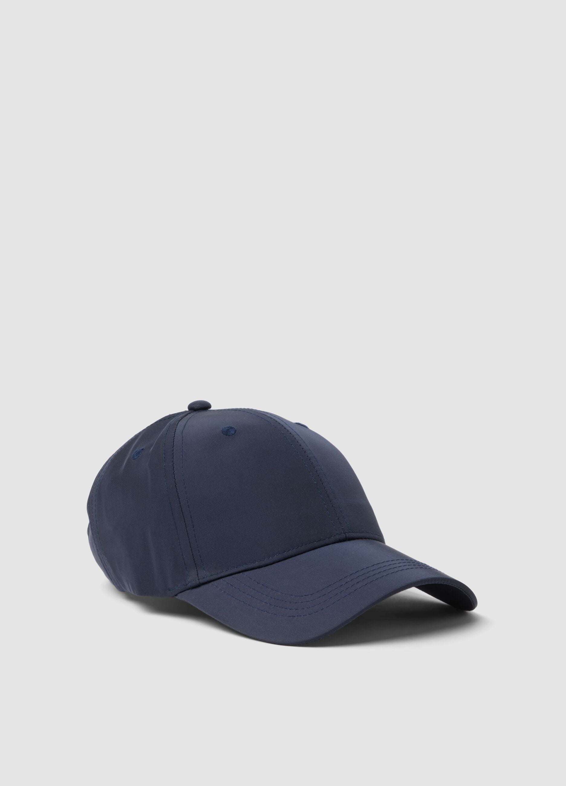 Blue cap with curved peak