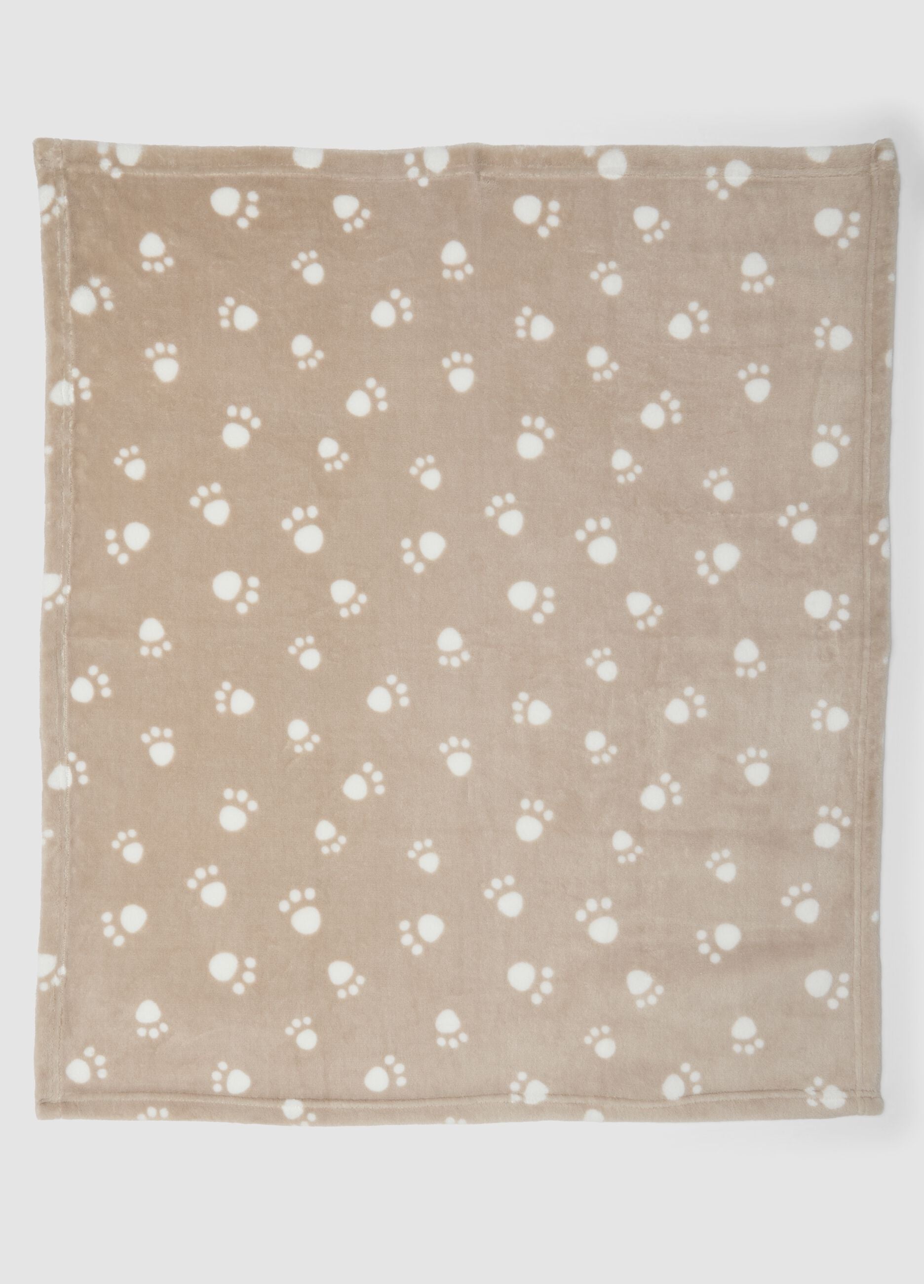 Copertina beige con stampa zampette per neonati