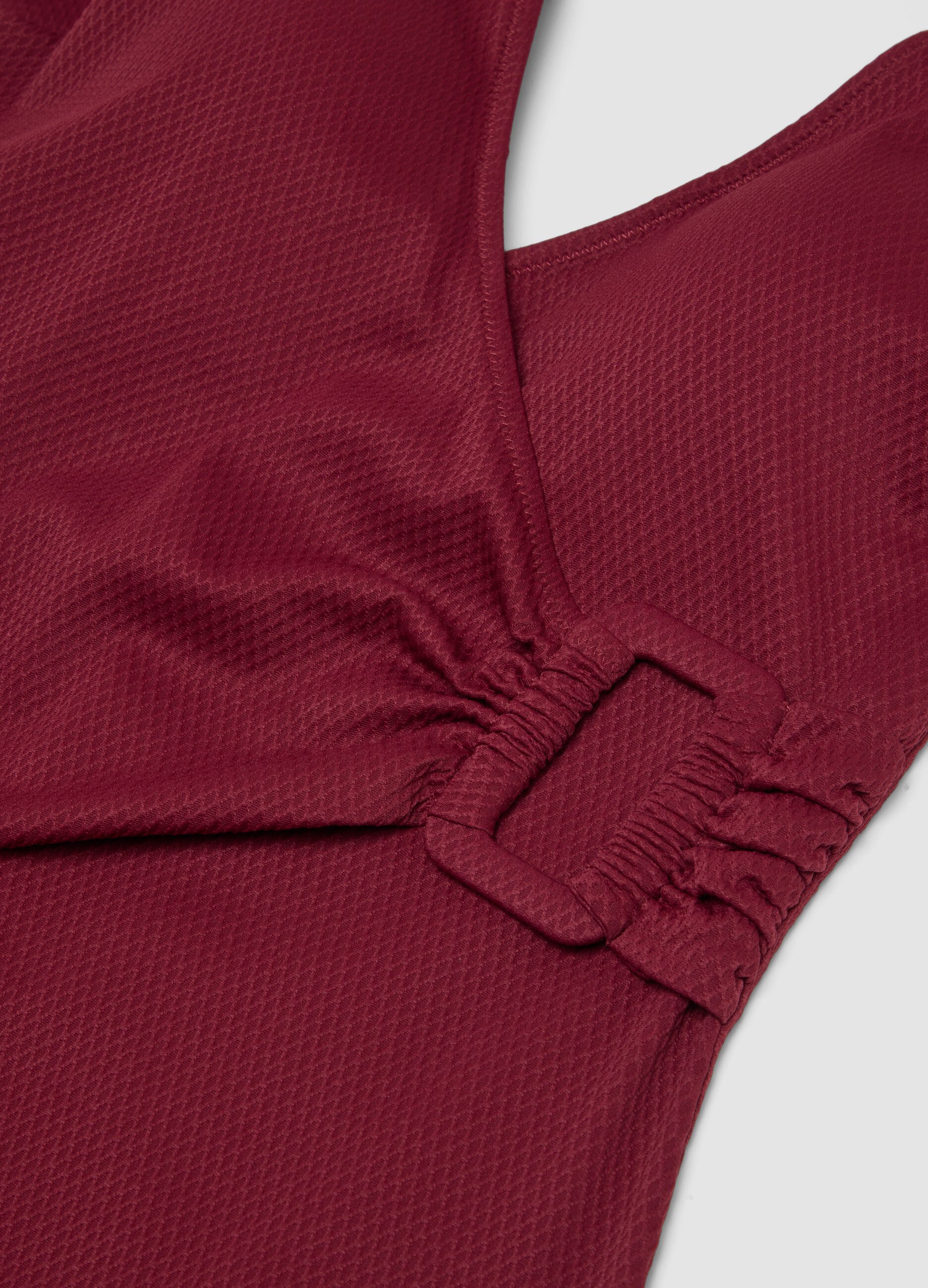Red stretch swimsuit with side buckle