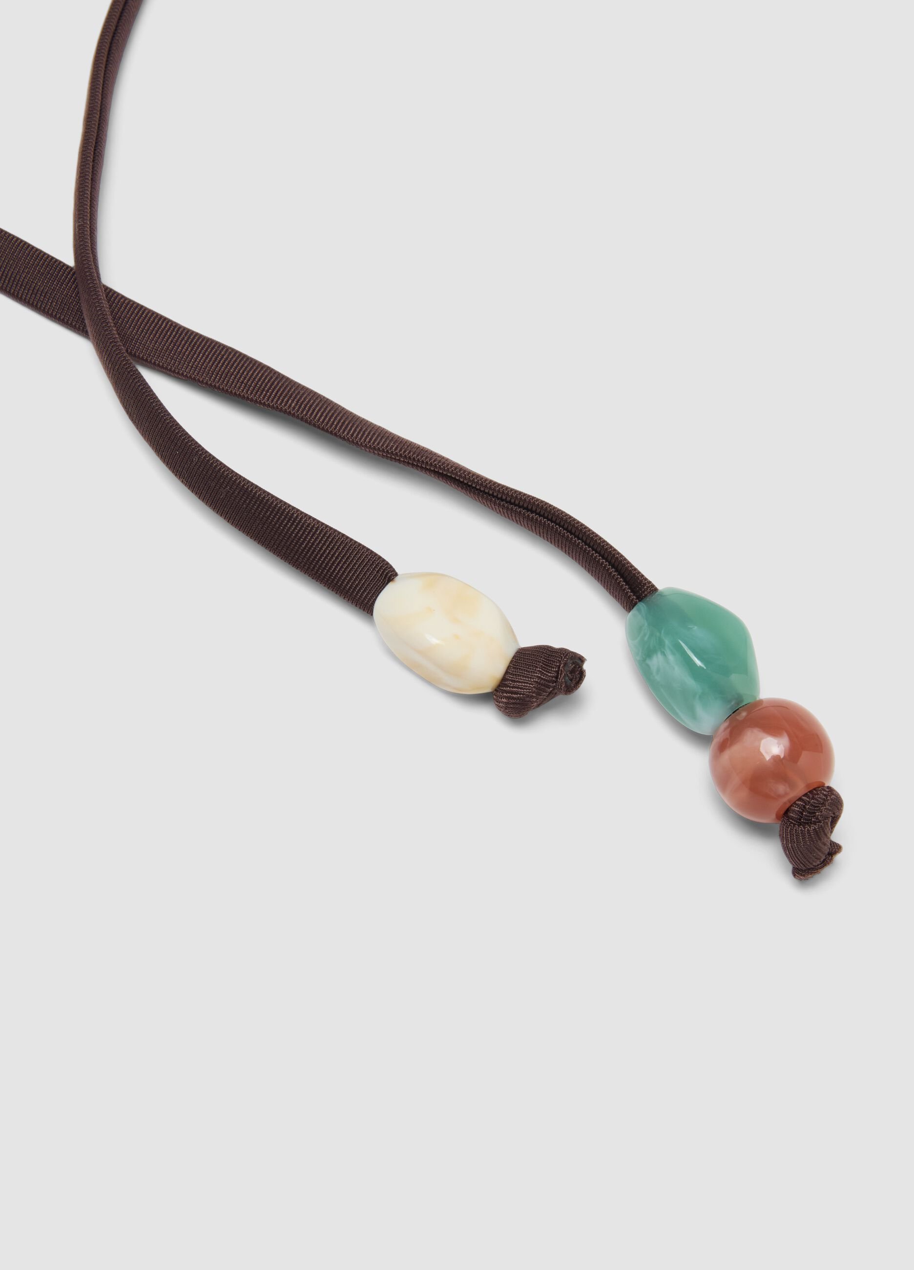 Brown stretch bikini bottoms with side ties and beads