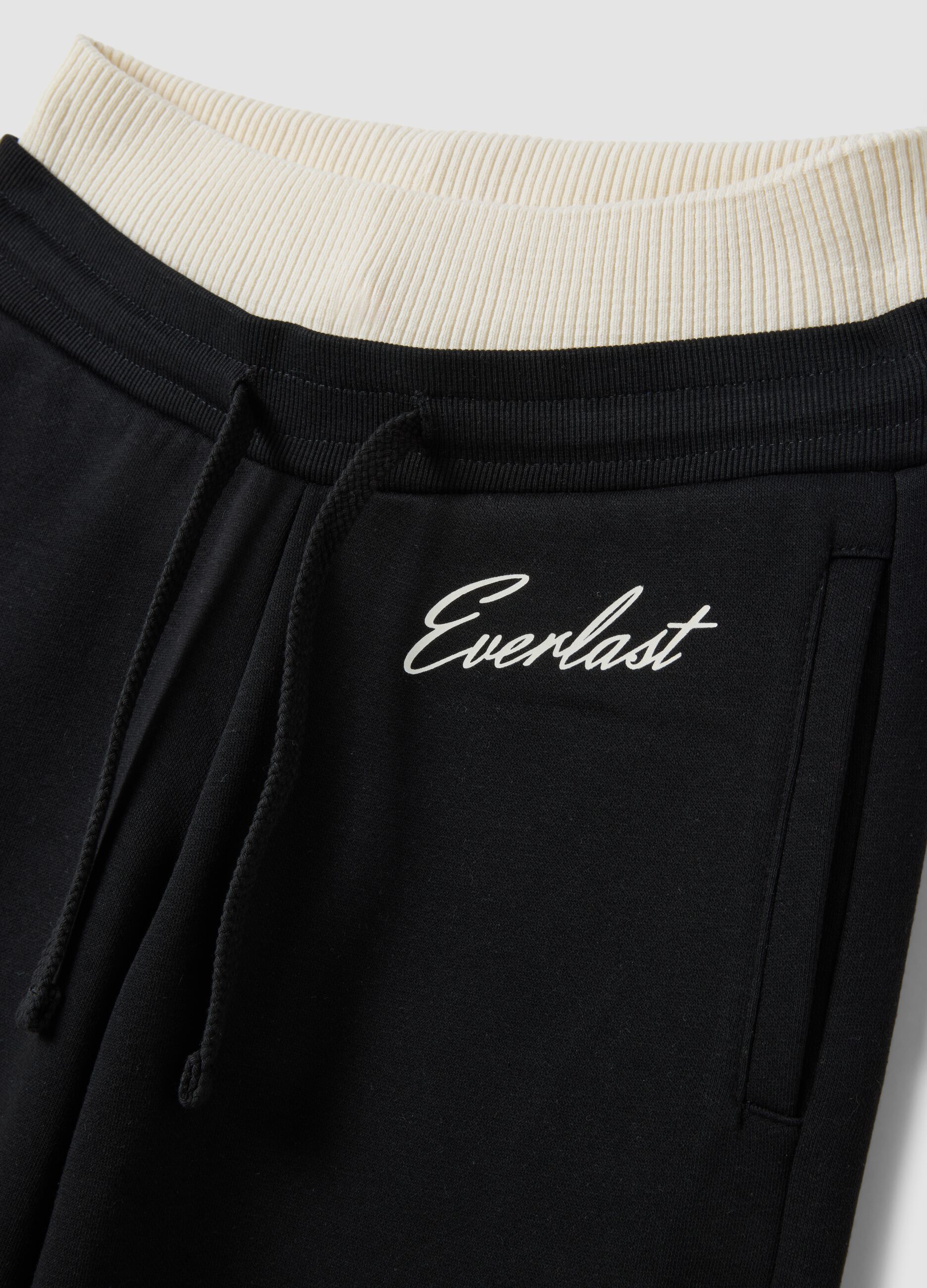 Black wide-leg cotton-blend trousers