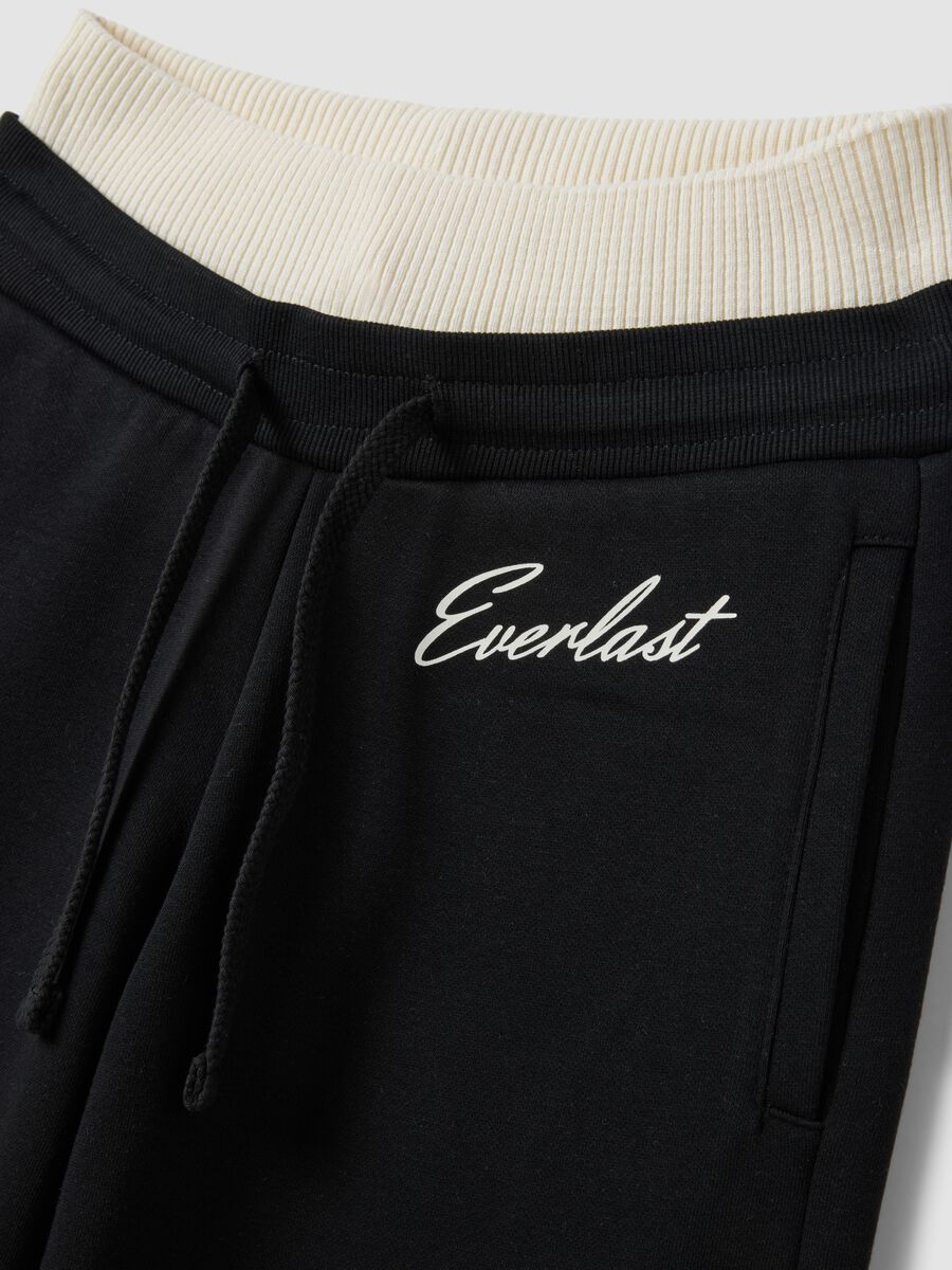 Black wide-leg cotton-blend trousers_1