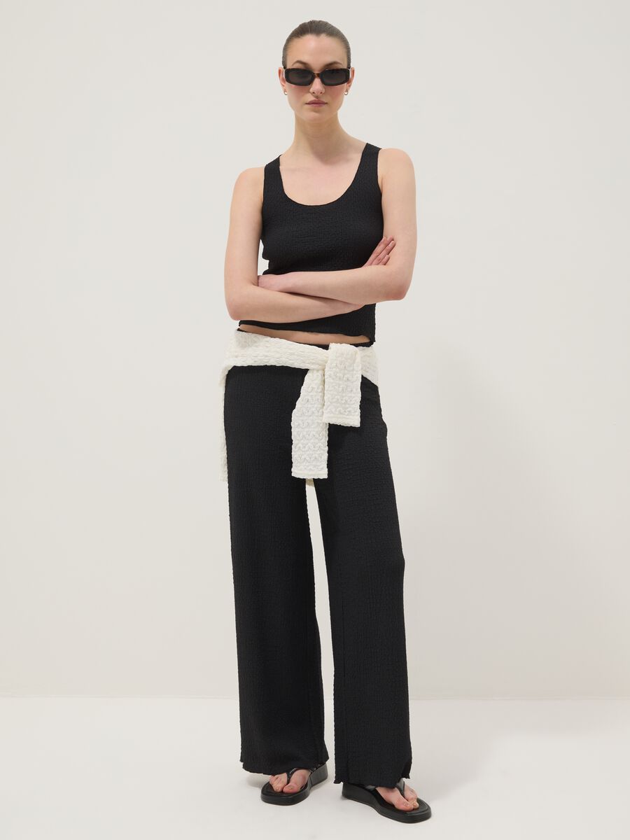 Black stretchy wide-leg trousers with crinkled texture_0